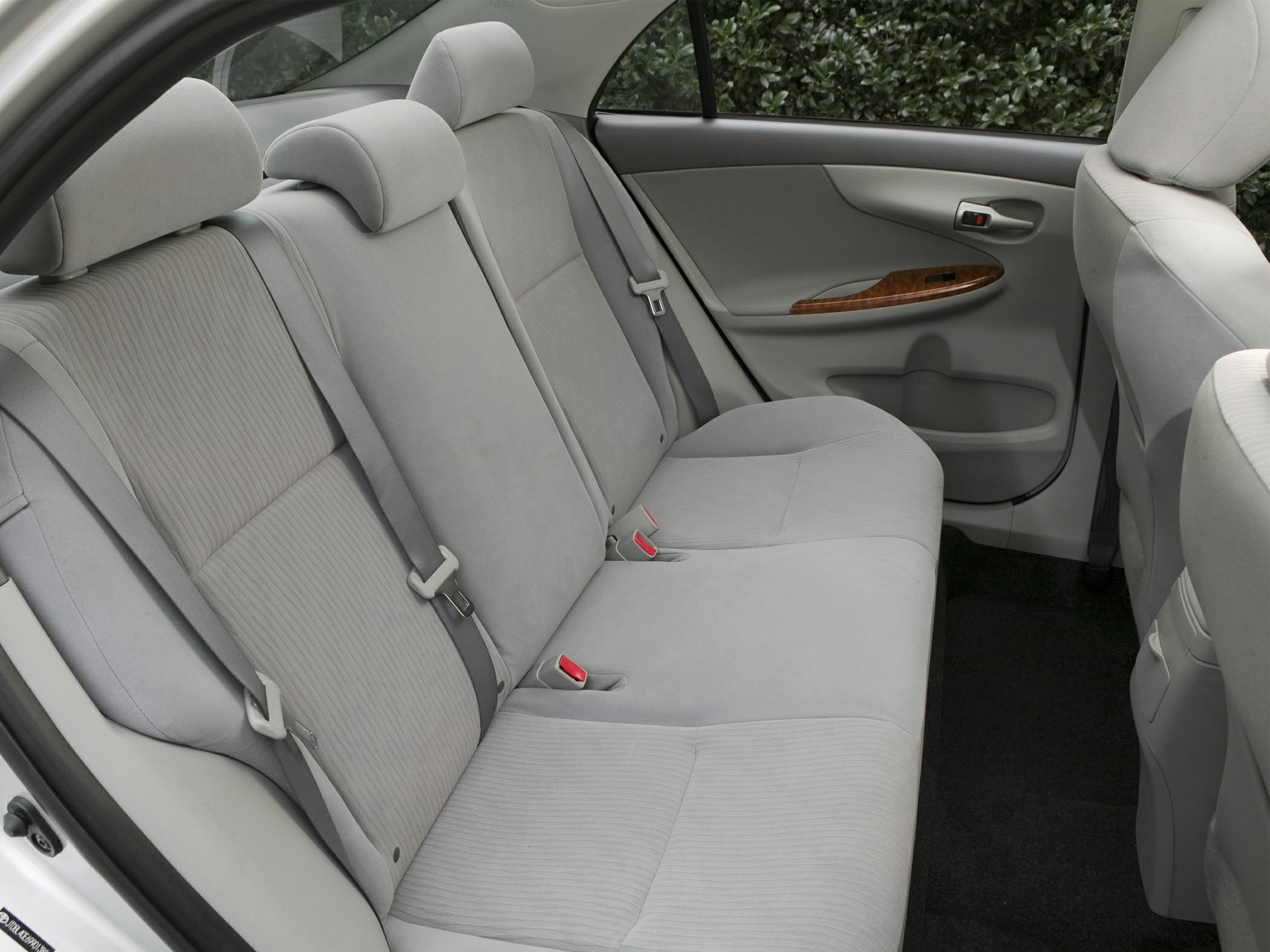 Spacious rear seat interior with seat belts and fabric upholstery
