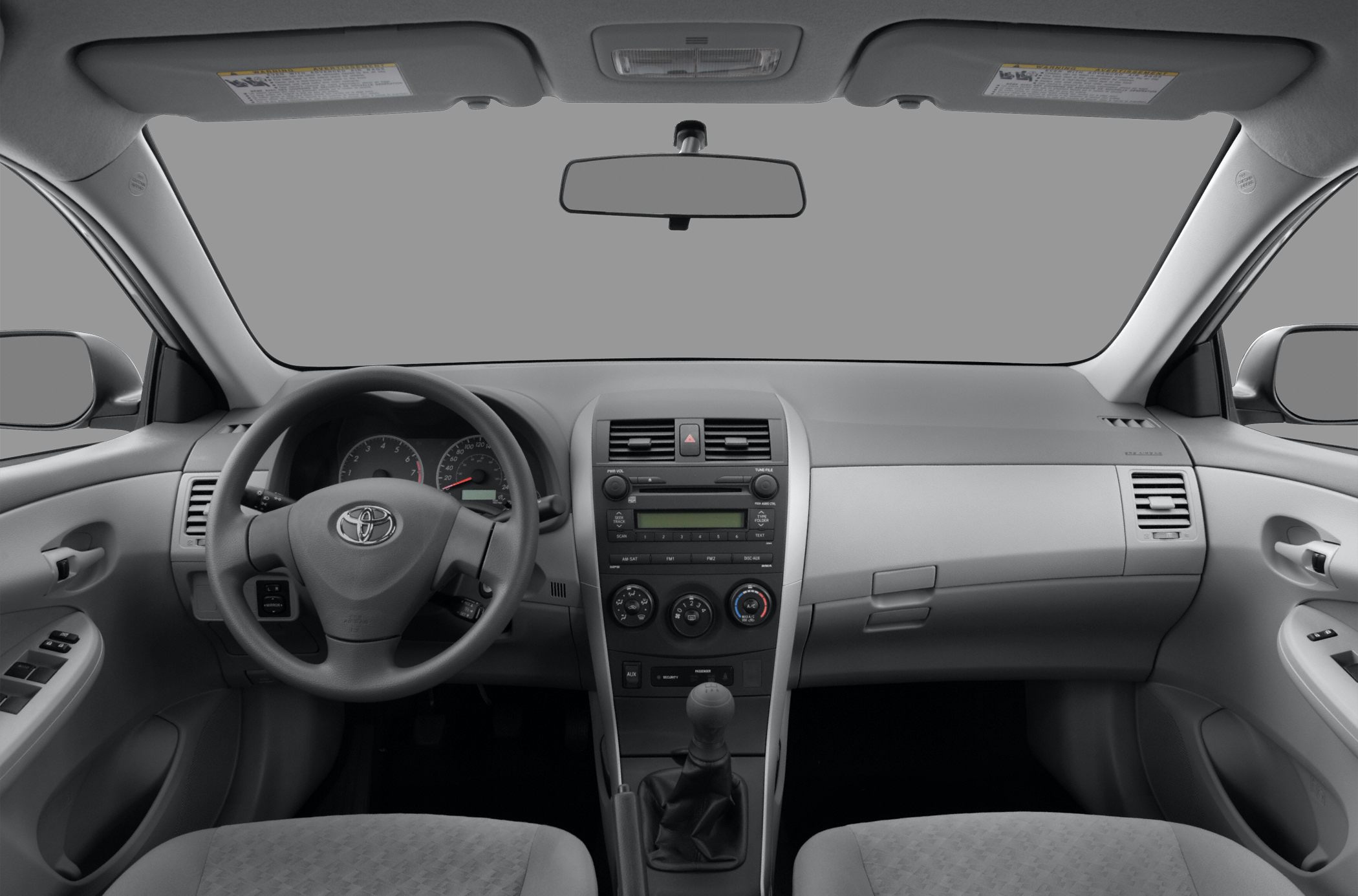 Dashboard and manual gear shift interior of a compact sedan