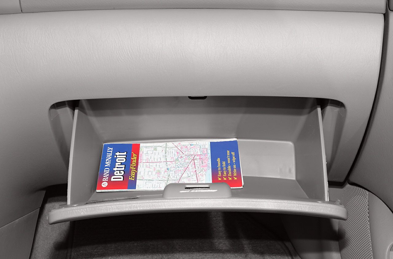 Open glove compartment with map inside