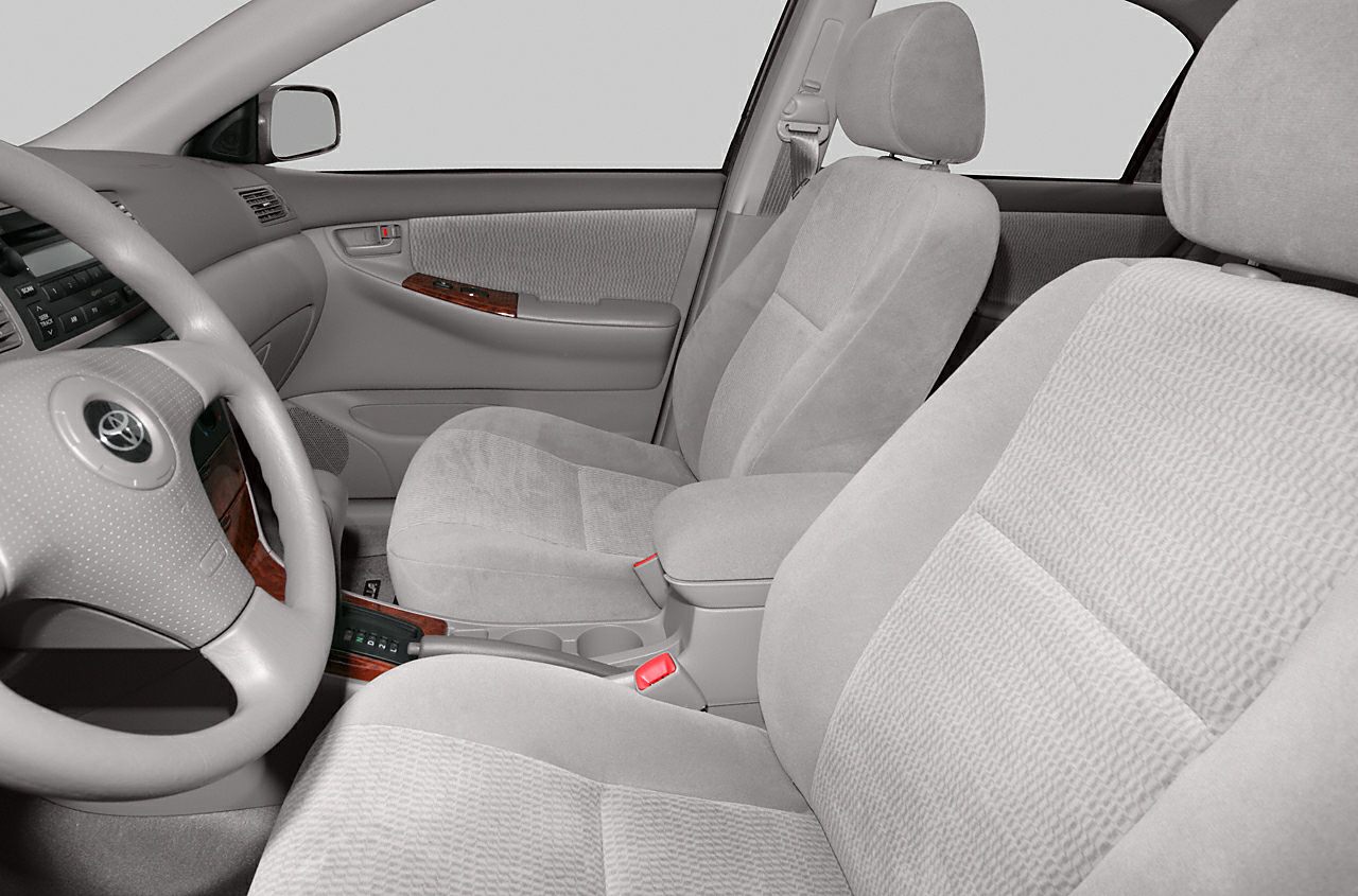 Front fabric seats and dashboard with wood trim interior