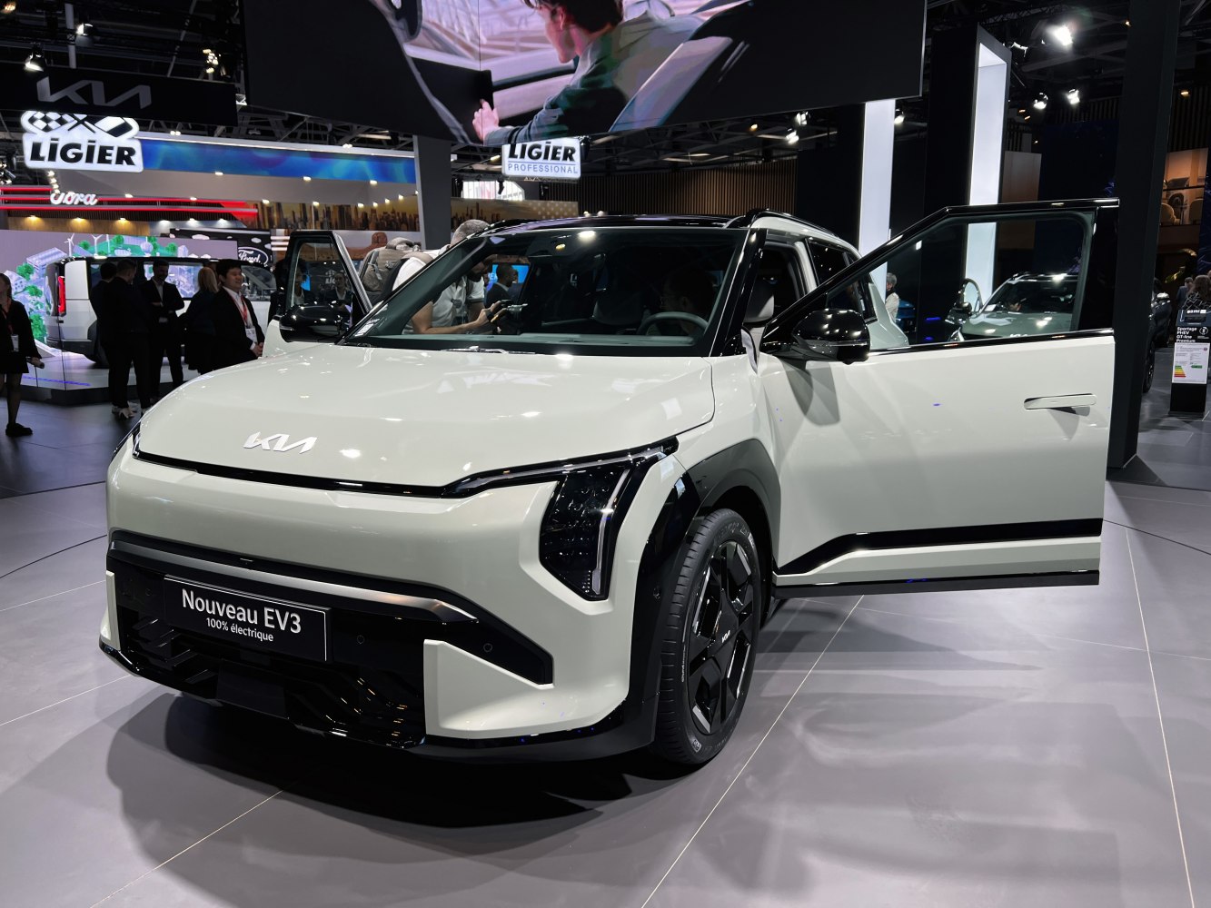 Front view of electric SUV with open driver door