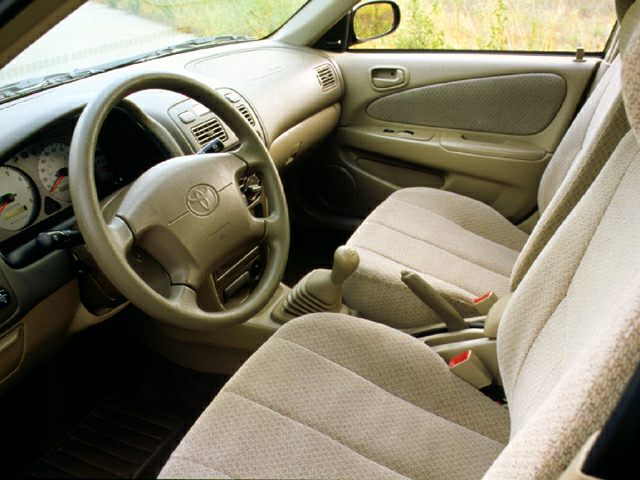 Beige fabric seats and manual gear shift interior view