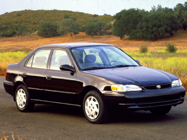 Classic sedan profile and front styling of early 90s vehicle