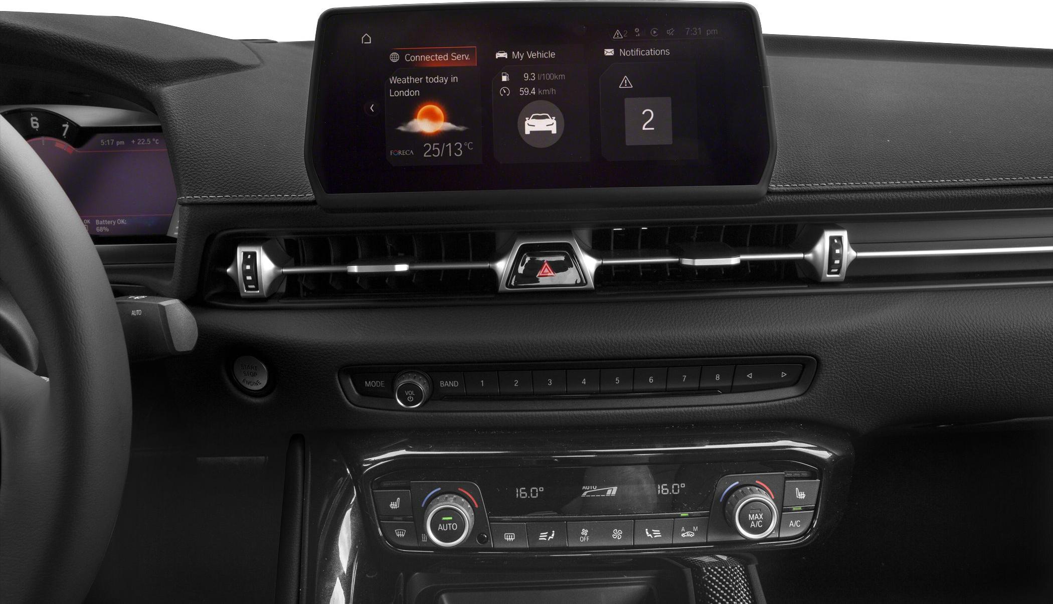Digital infotainment display and climate control panel in car interior