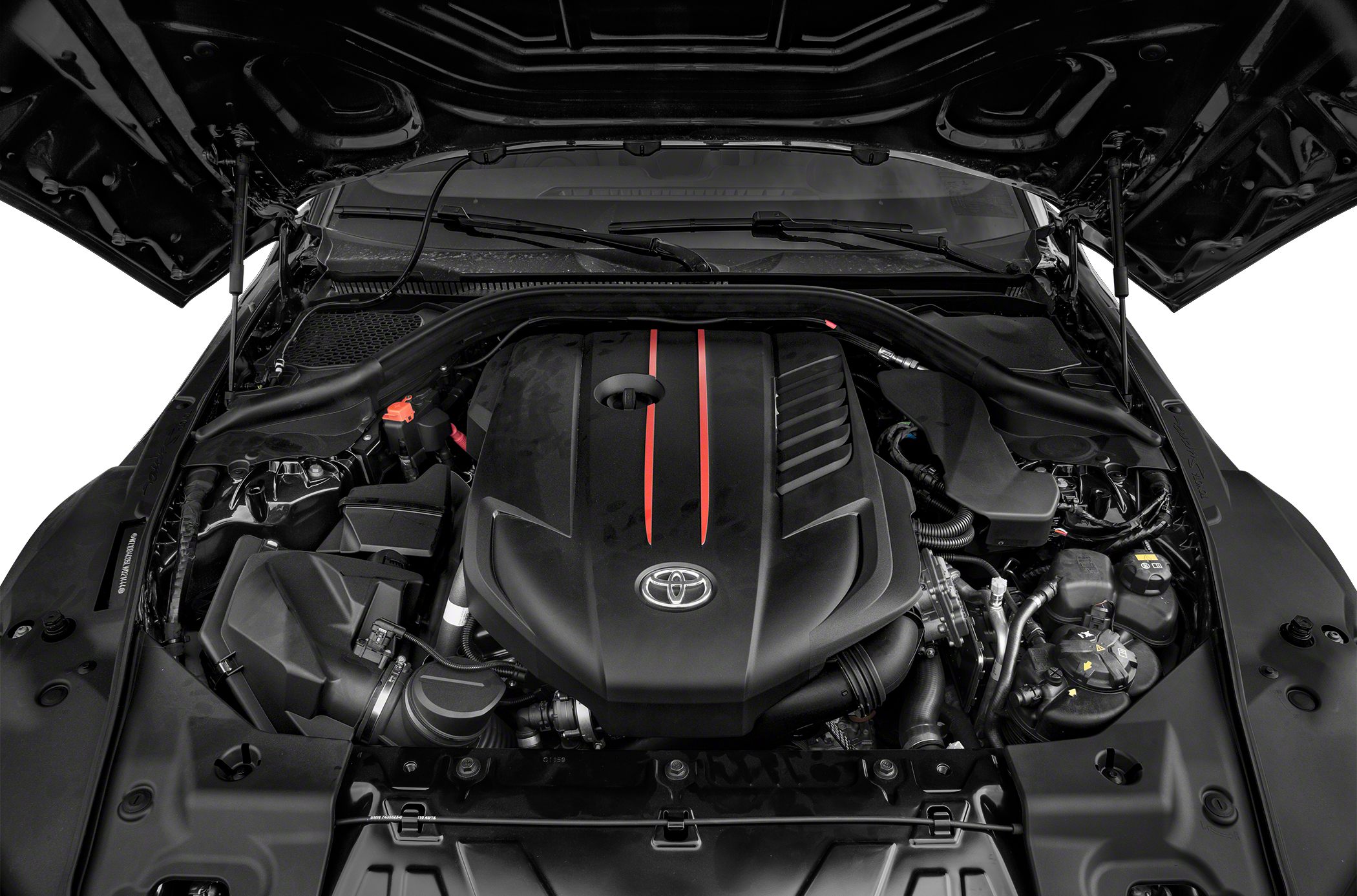 Detailed view of a modern engine bay with a prominent engine cover and structural braces.