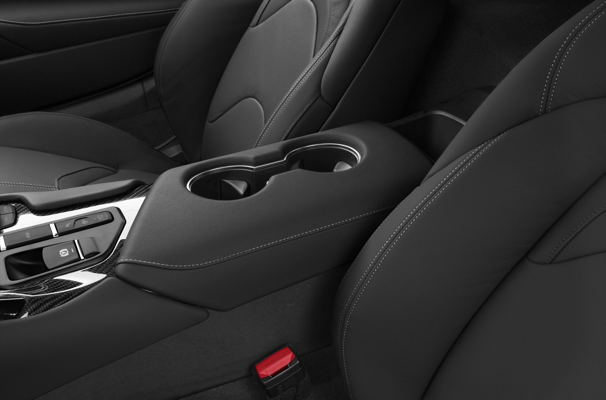 Leather seats and center console with cup holders and control buttons