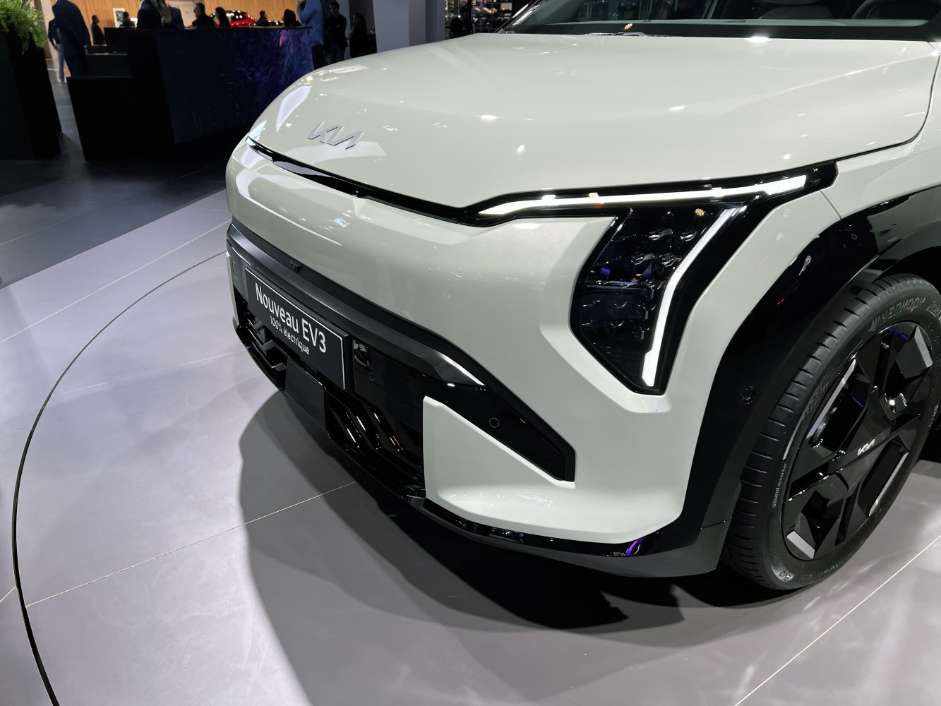 Close-up of front fascia with LED headlights and black wheel design