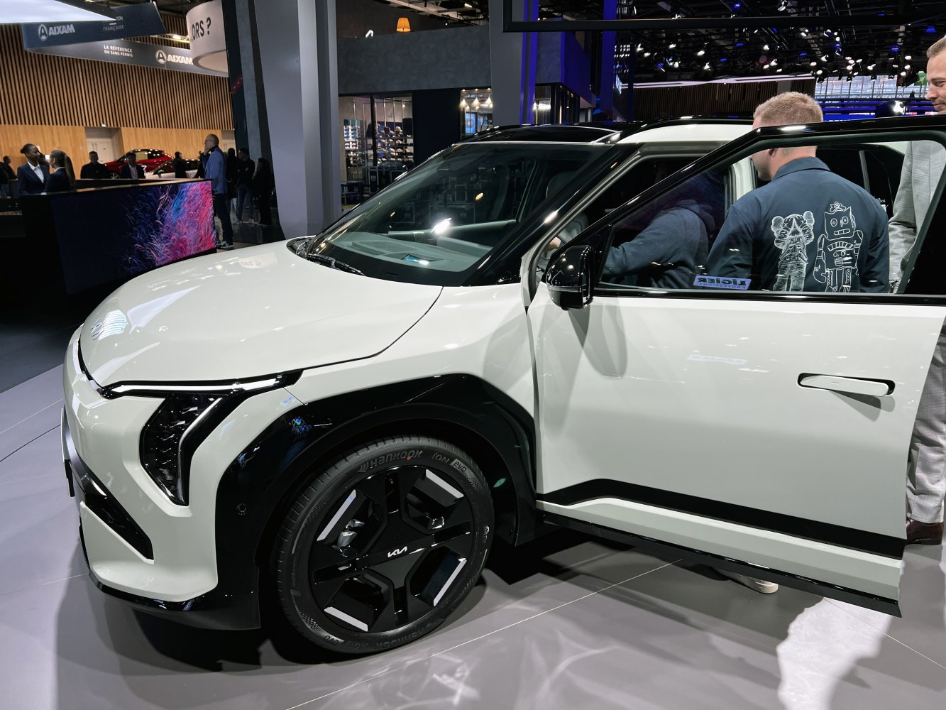 Front and side view of electric SUV with modern headlights and black rims