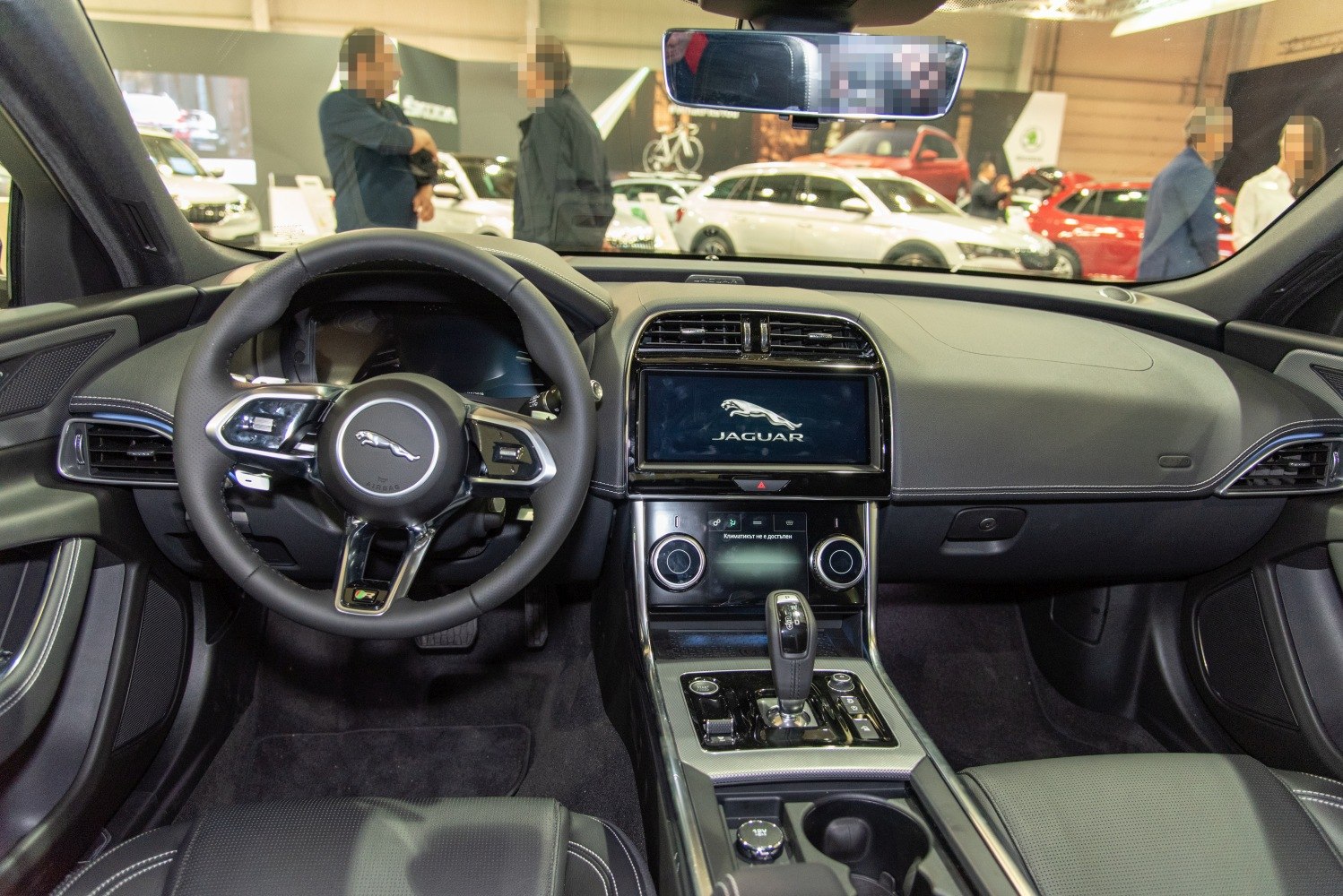Modern interior dashboard and steering wheel with infotainment screen