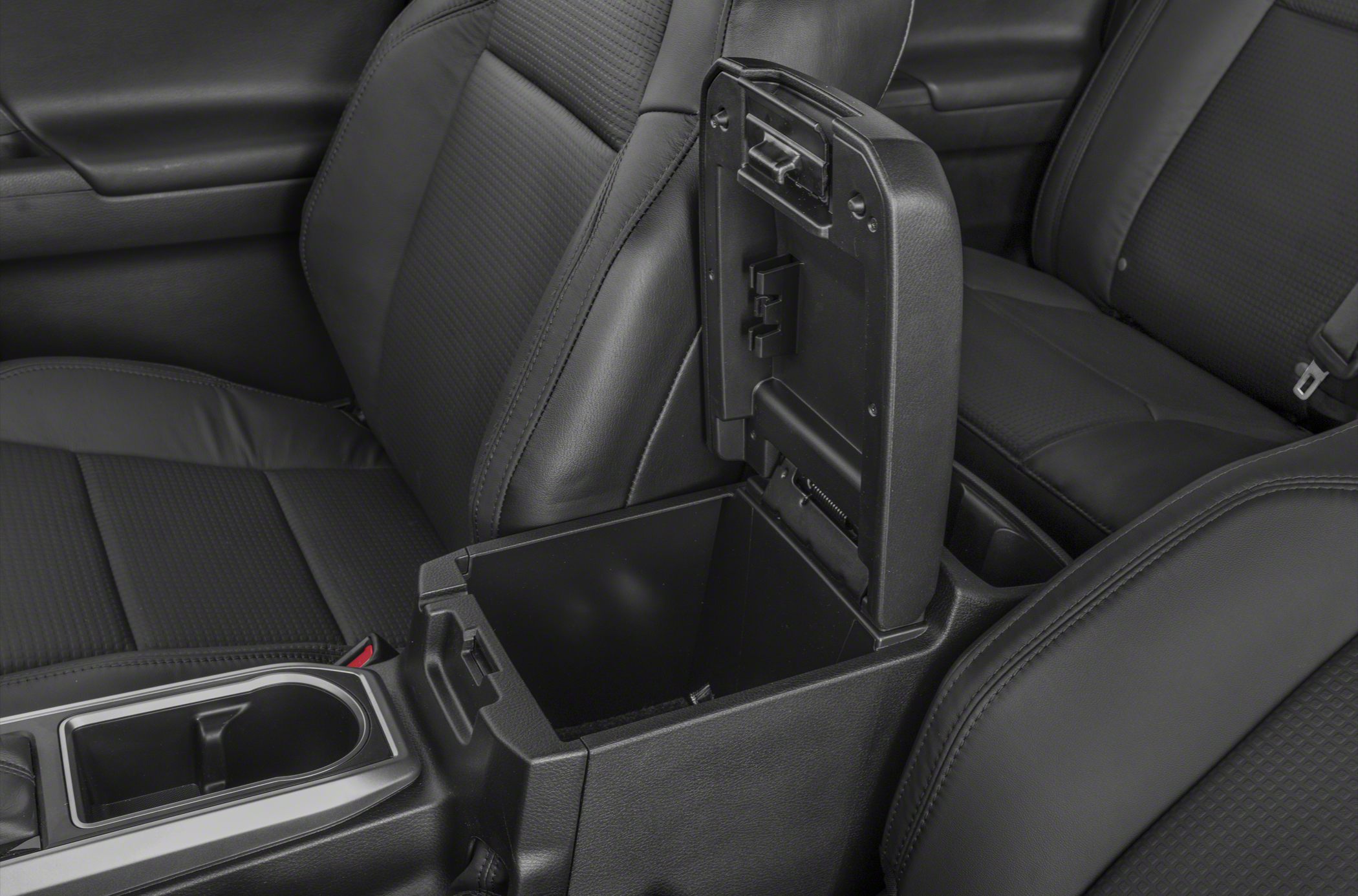 Open center console storage between front seats with black upholstery