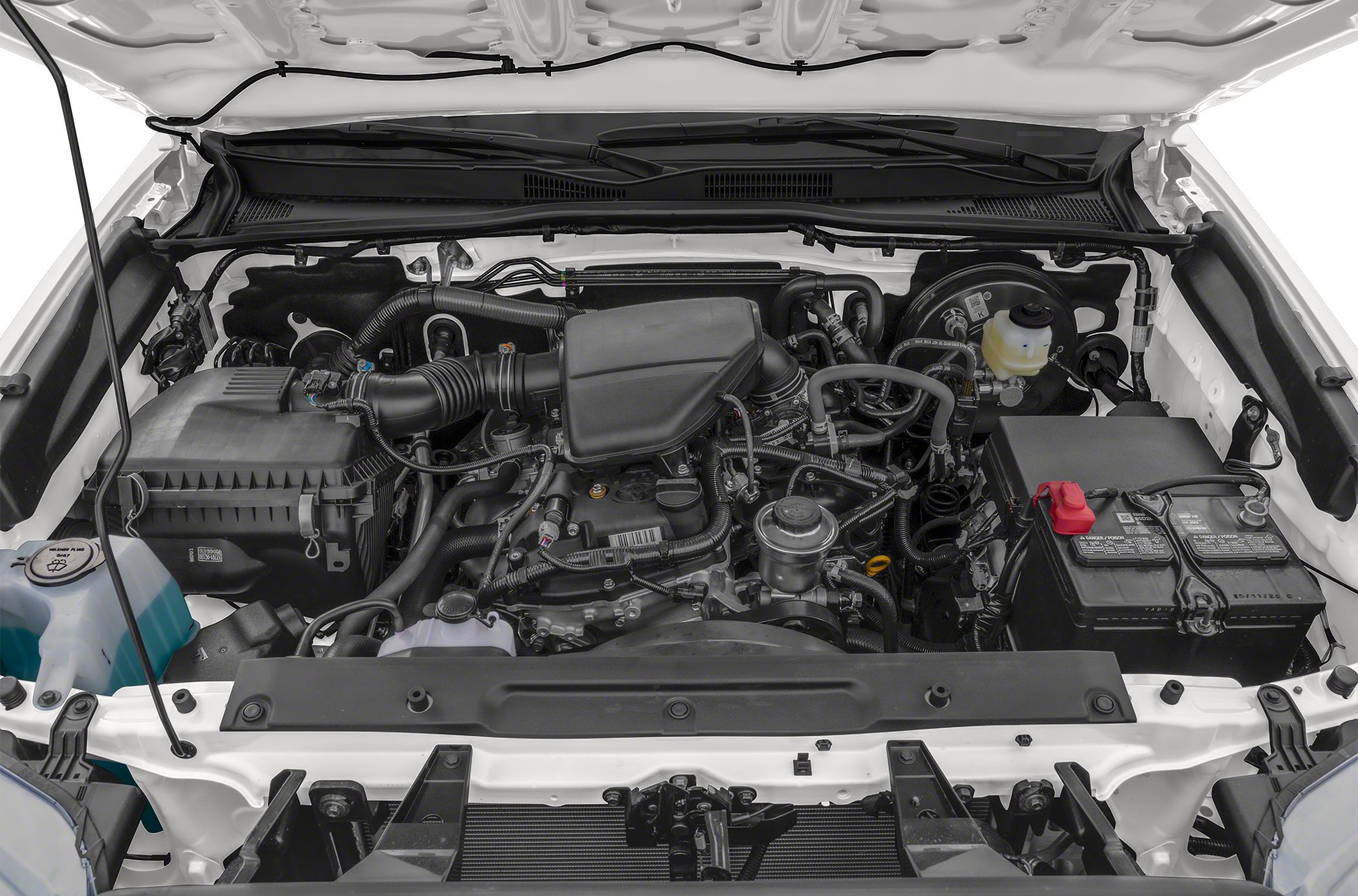 Engine bay with air intake, battery, fluid reservoirs, and wiring layout