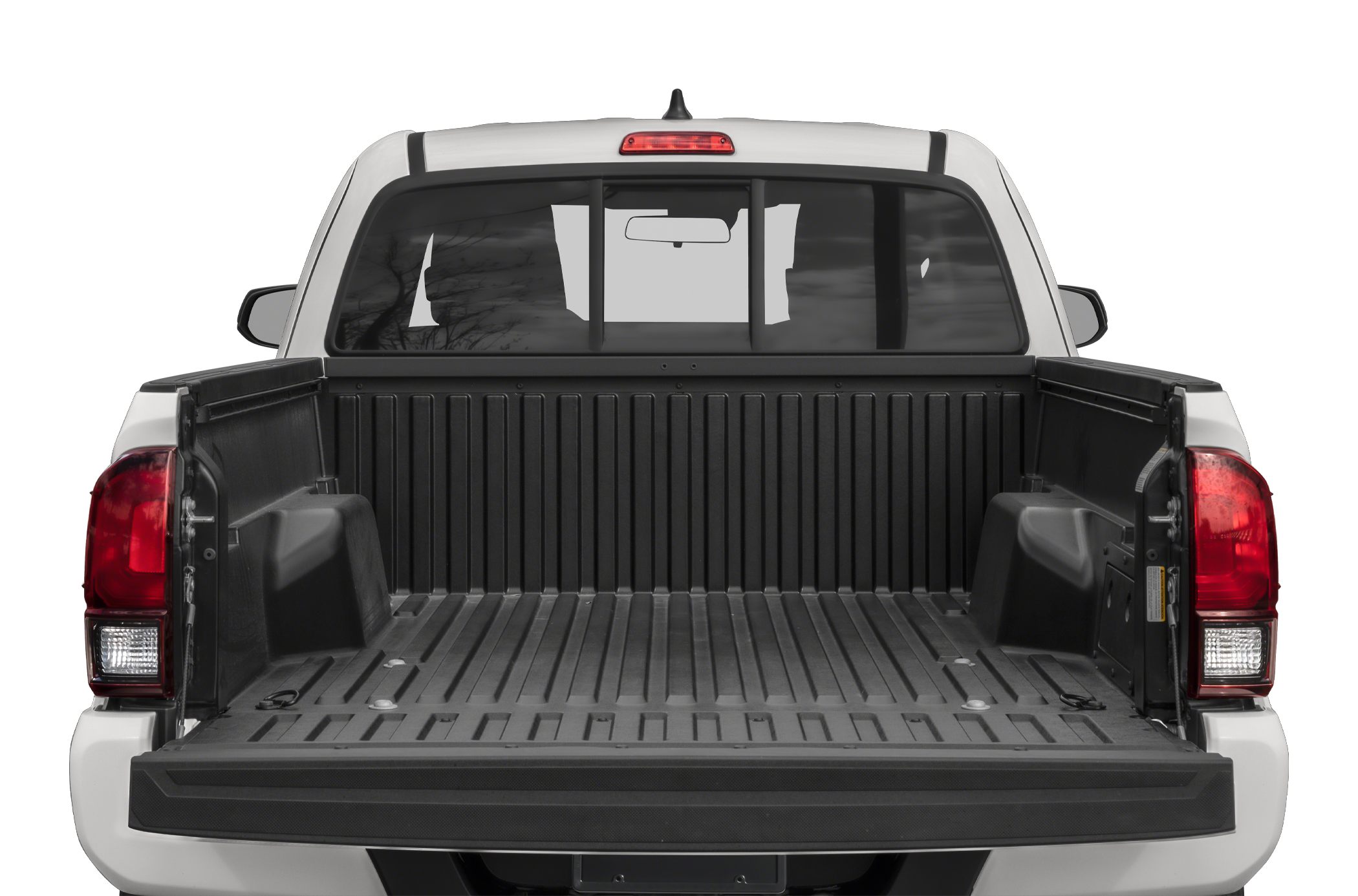 Rear view of pickup truck bed with tailgate lowered and black bed liner.