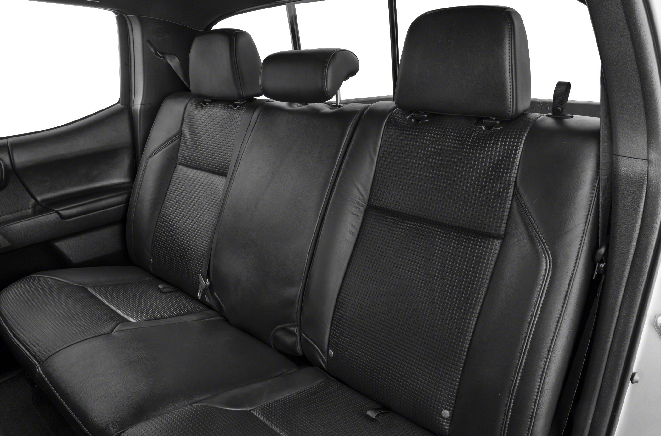 Black leather rear bench seats with textured inserts and adjustable headrests