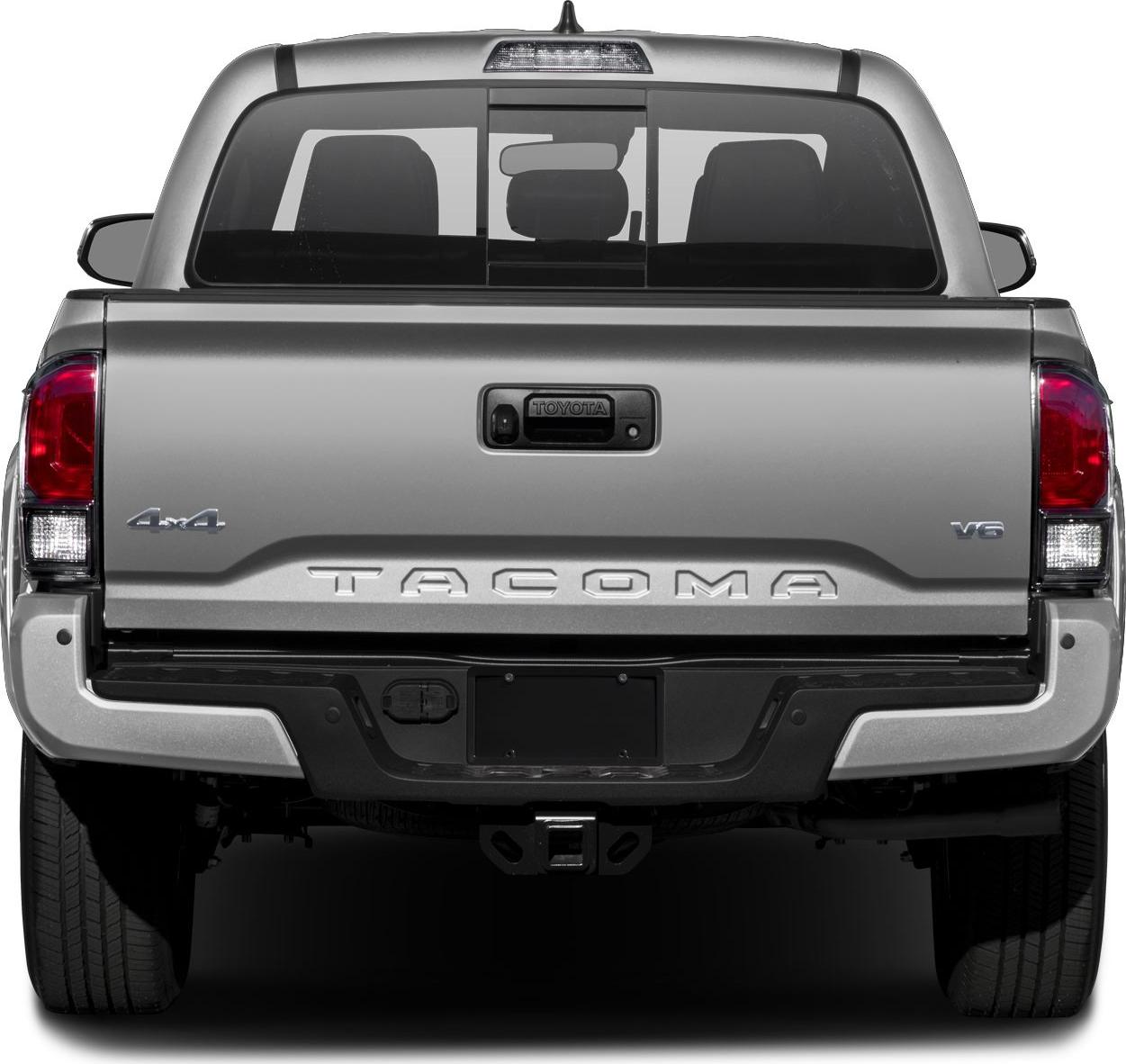 Rear view of a pickup tailgate with 4x4 and V6 badges