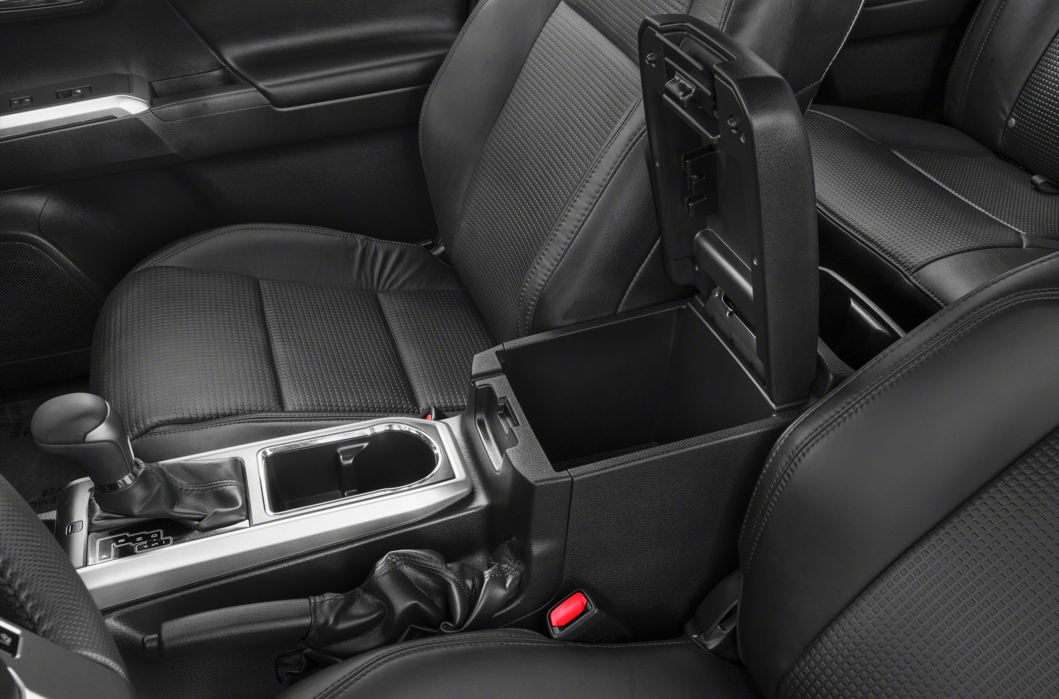 Center console storage with gear shift and open armrest compartment