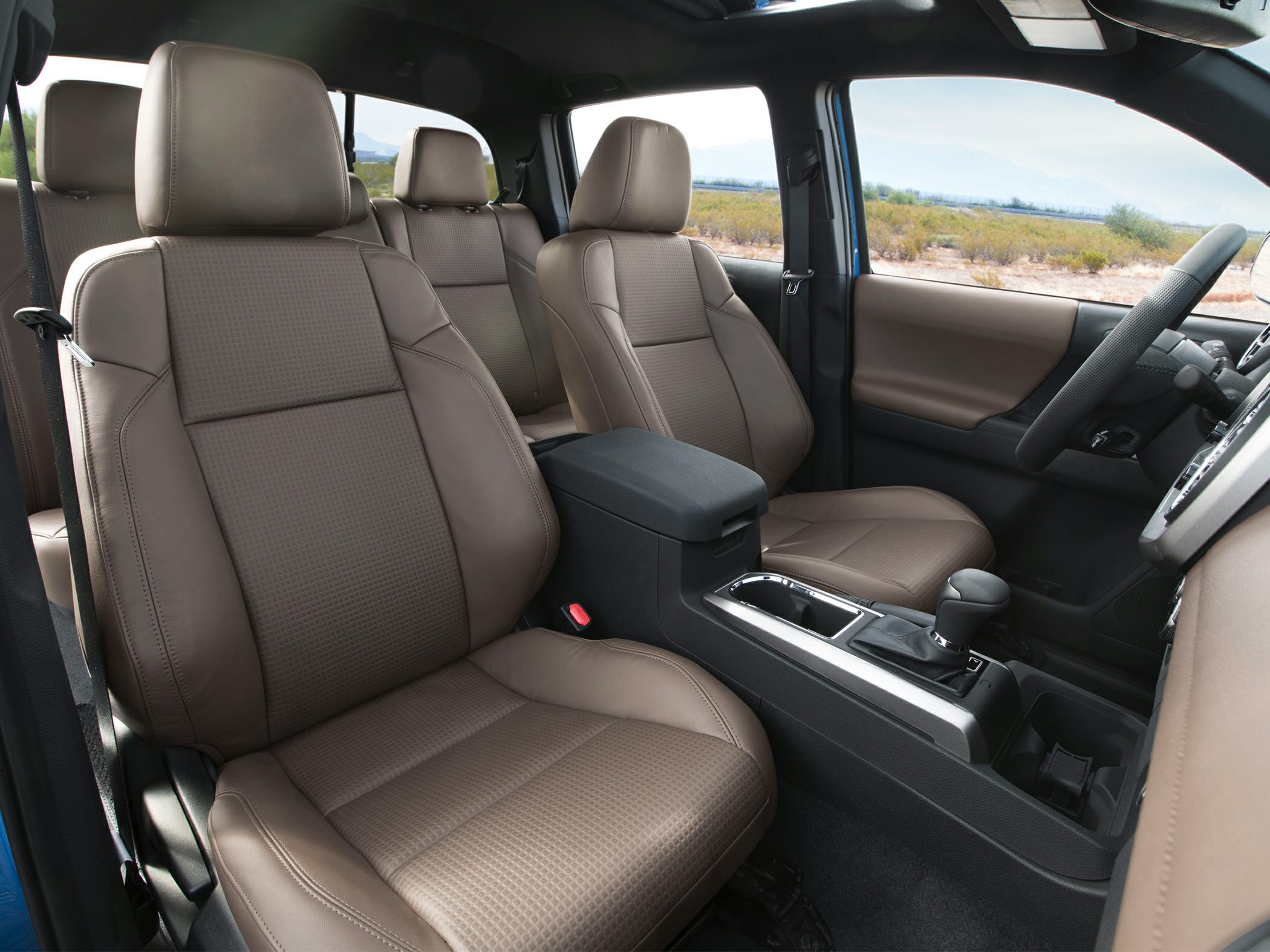 Brown leather seats with center console and gear shifter
