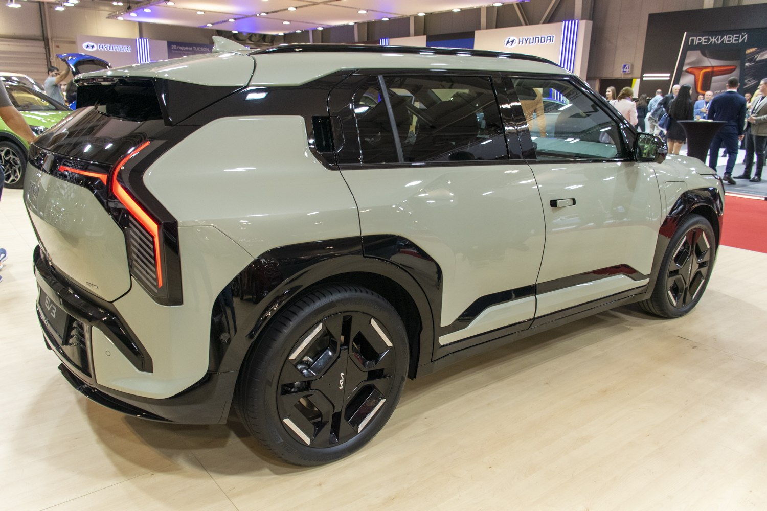 Modern electric SUV with distinctive LED taillights and bold geometric wheels
