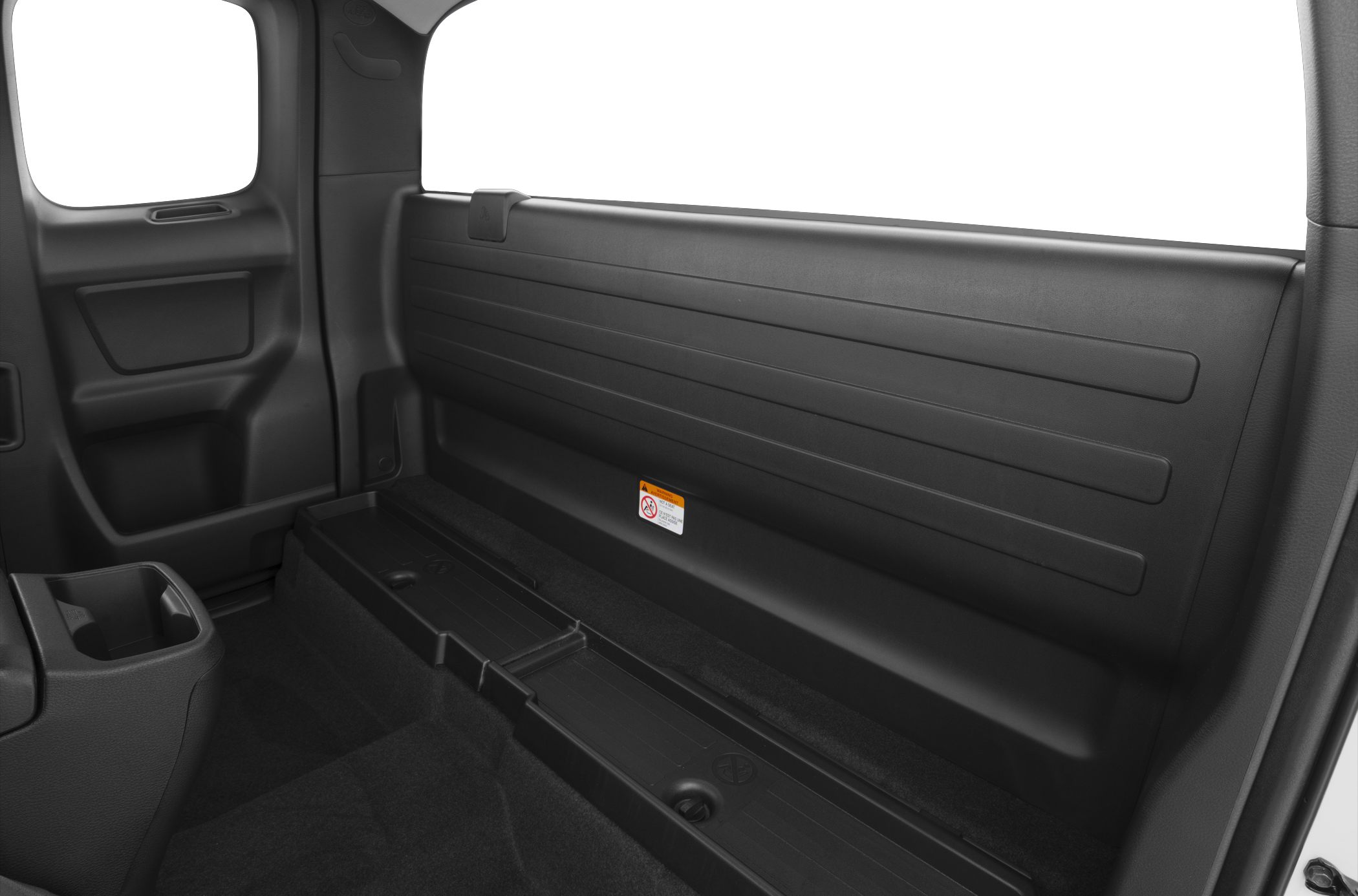 Rear interior storage area and back panel of a pickup truck