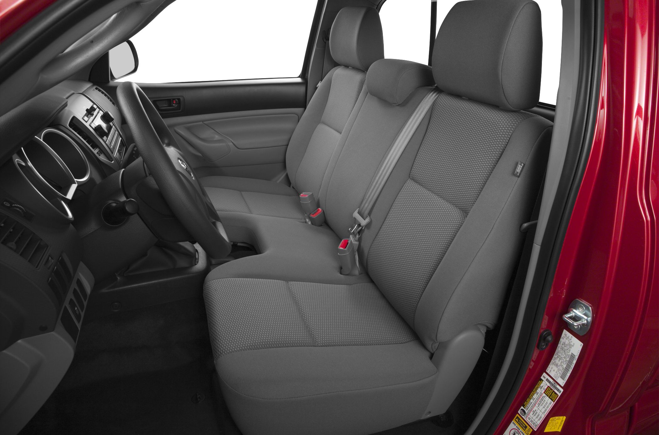 Front bench seating with grey upholstery and manual transmission interior