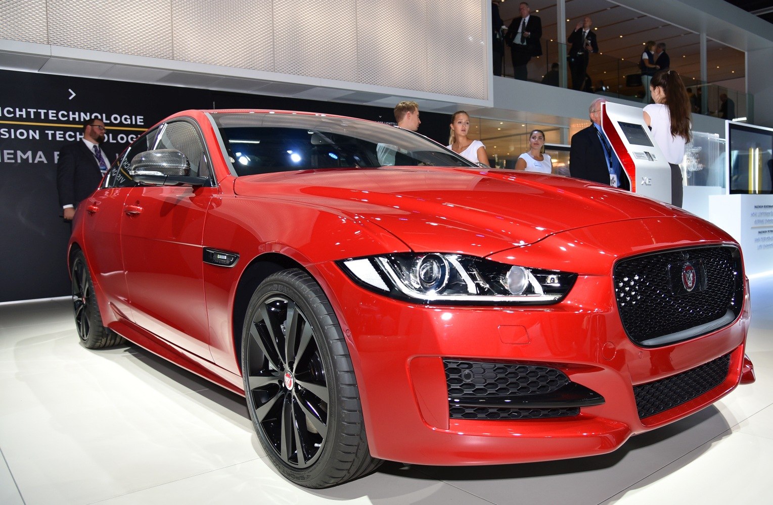 Red sedan with LED headlights and black multi-spoke rims