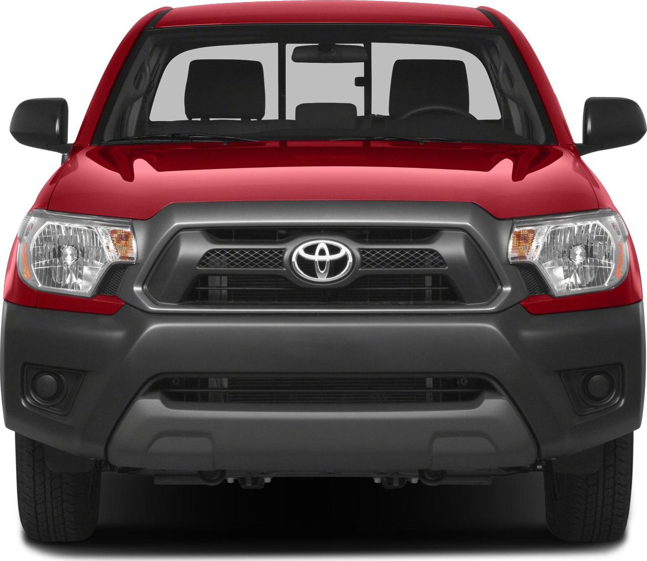 Front view of red pickup with distinctive headlights and bold grille.