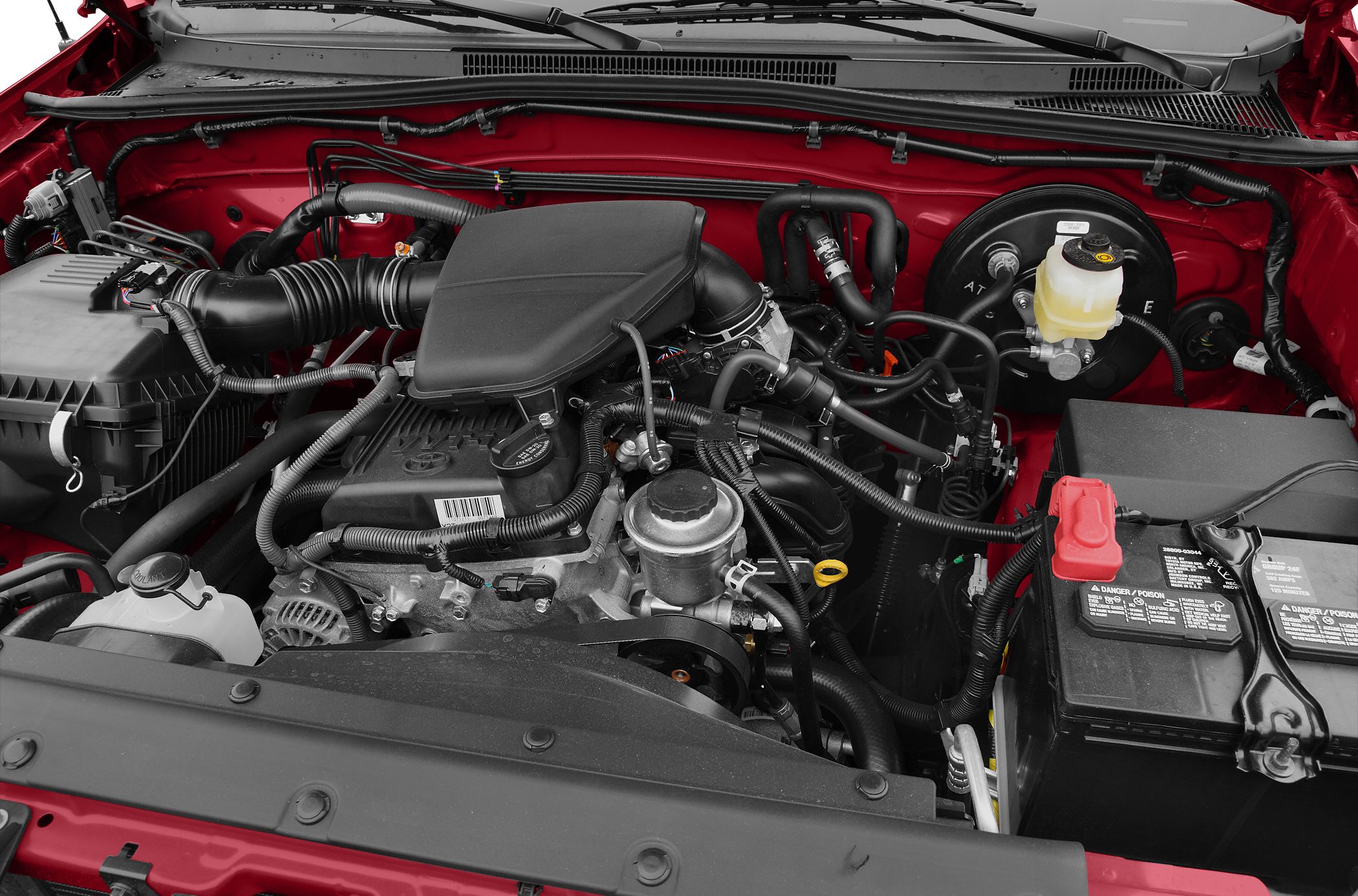 Engine bay with air intake, battery, brake fluid reservoir