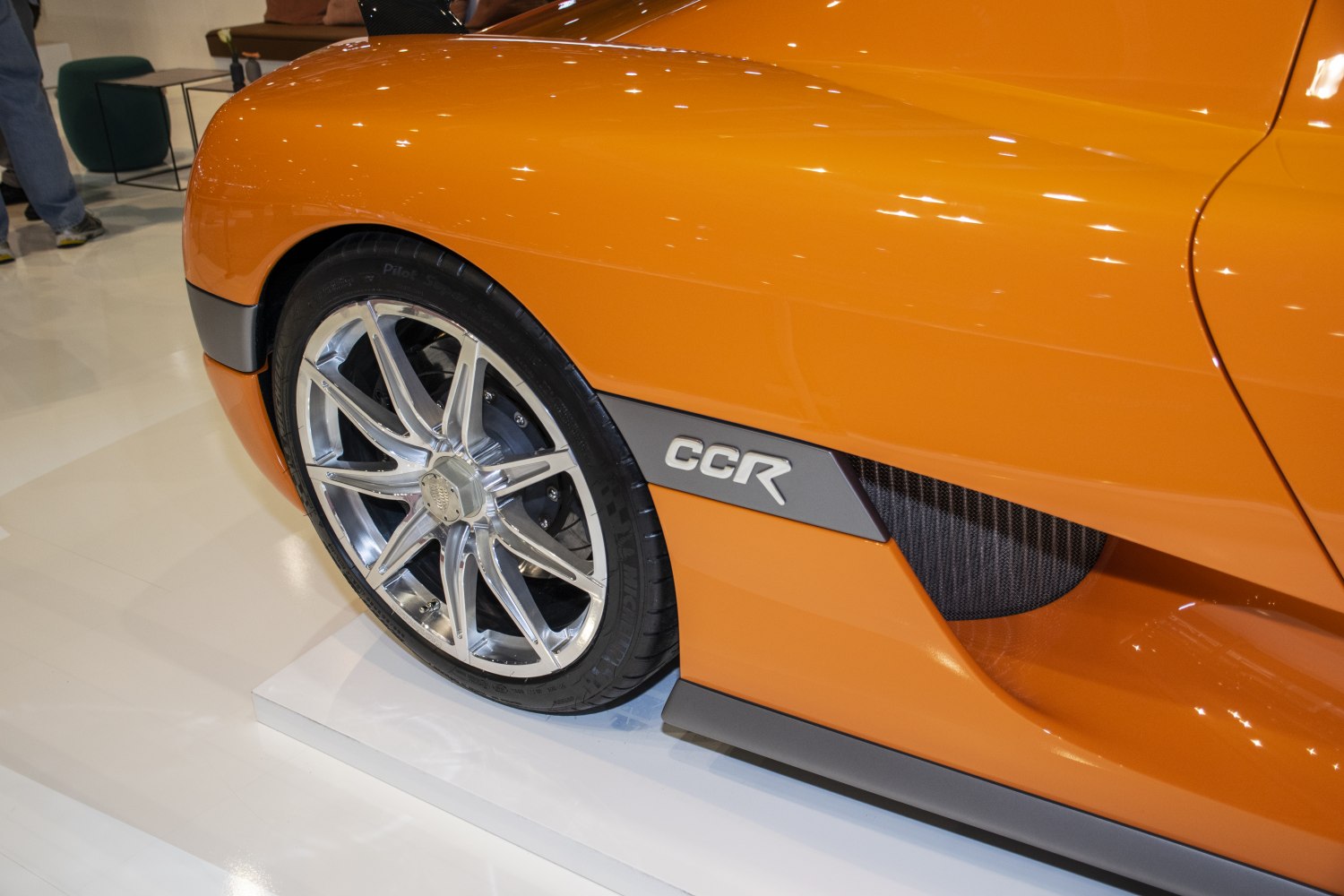 Close-up of car wheel and side vent with CCR badge