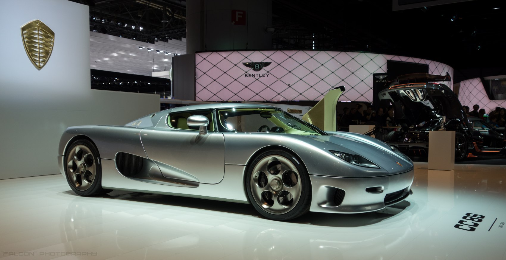 Silver aerodynamic sports coupe with five-spoke wheels