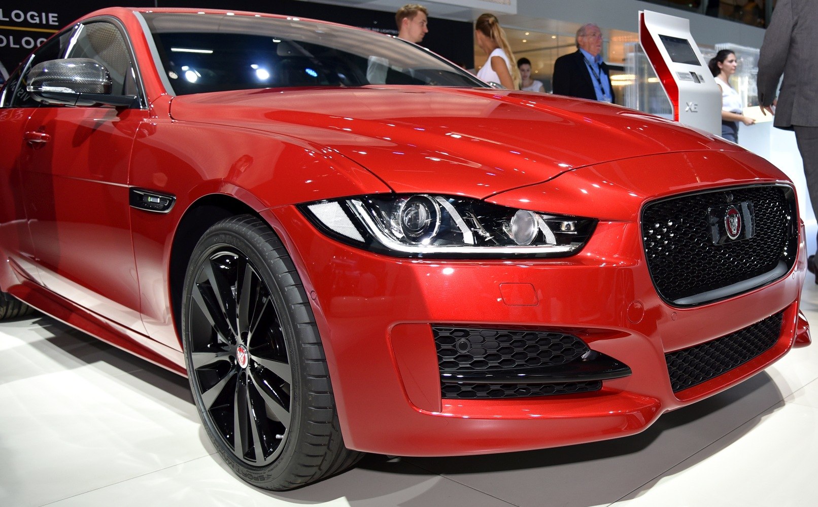 Front view with sleek headlights and black alloy wheels