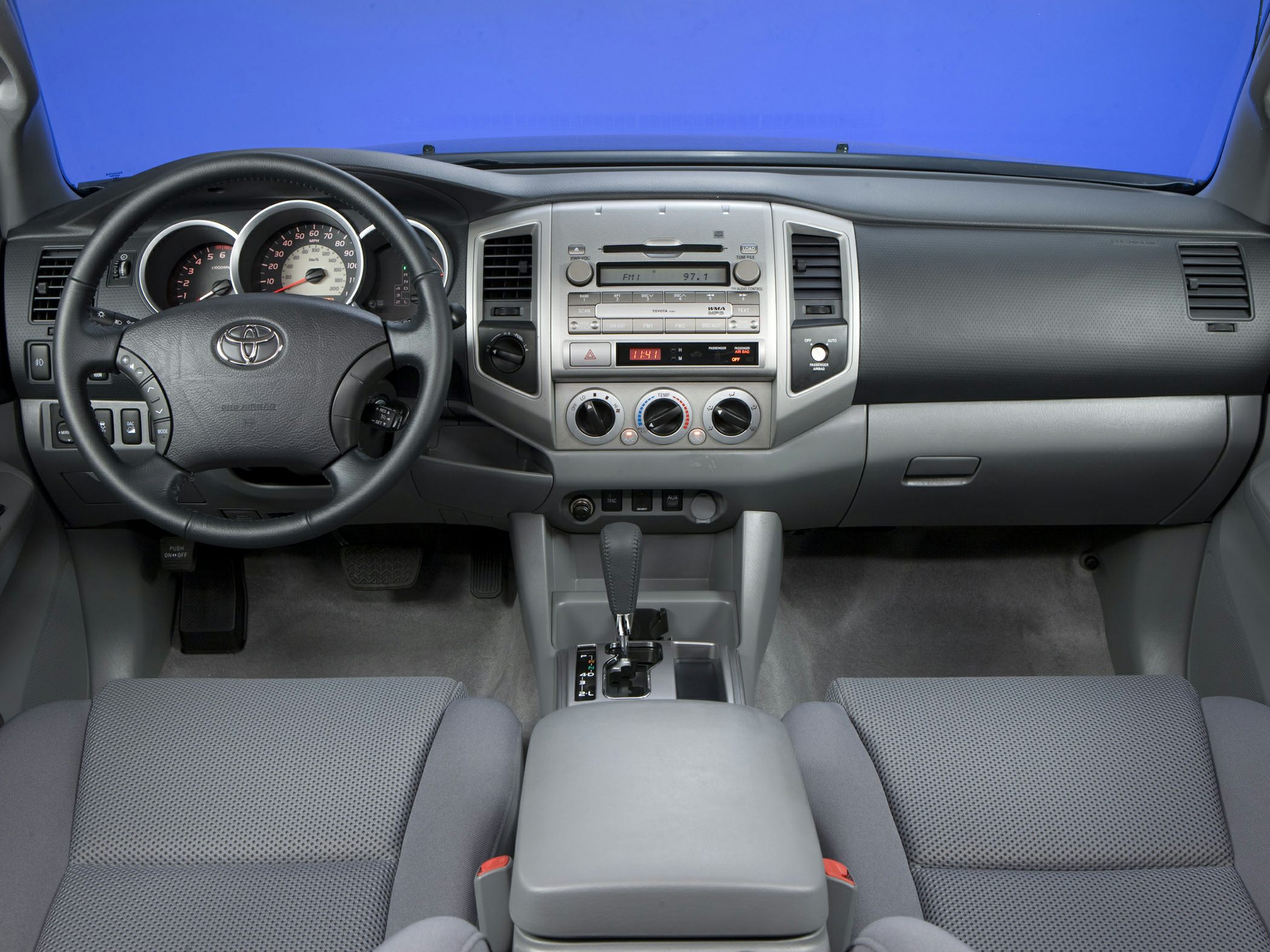Dashboard and steering wheel with center console in a vehicle interior