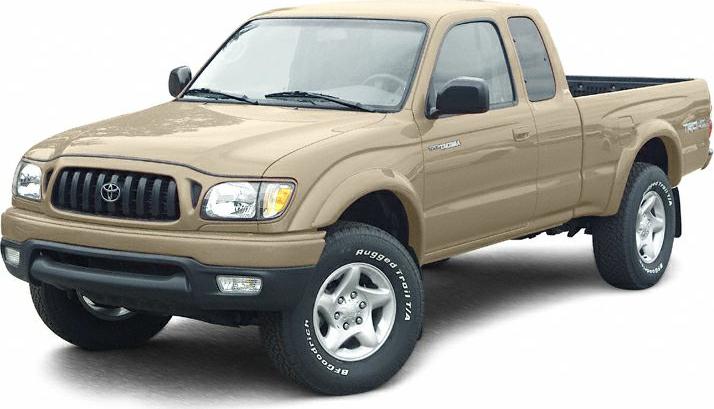 Beige mid-size pickup truck with extended cab and off-road tires