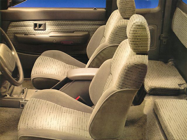 Interior seating design with patterned fabric and armrest