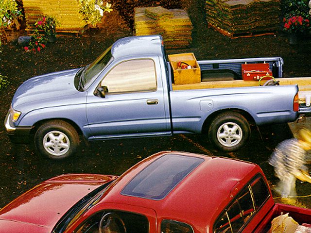 Side profile of a single cab pickup truck with loaded cargo bed