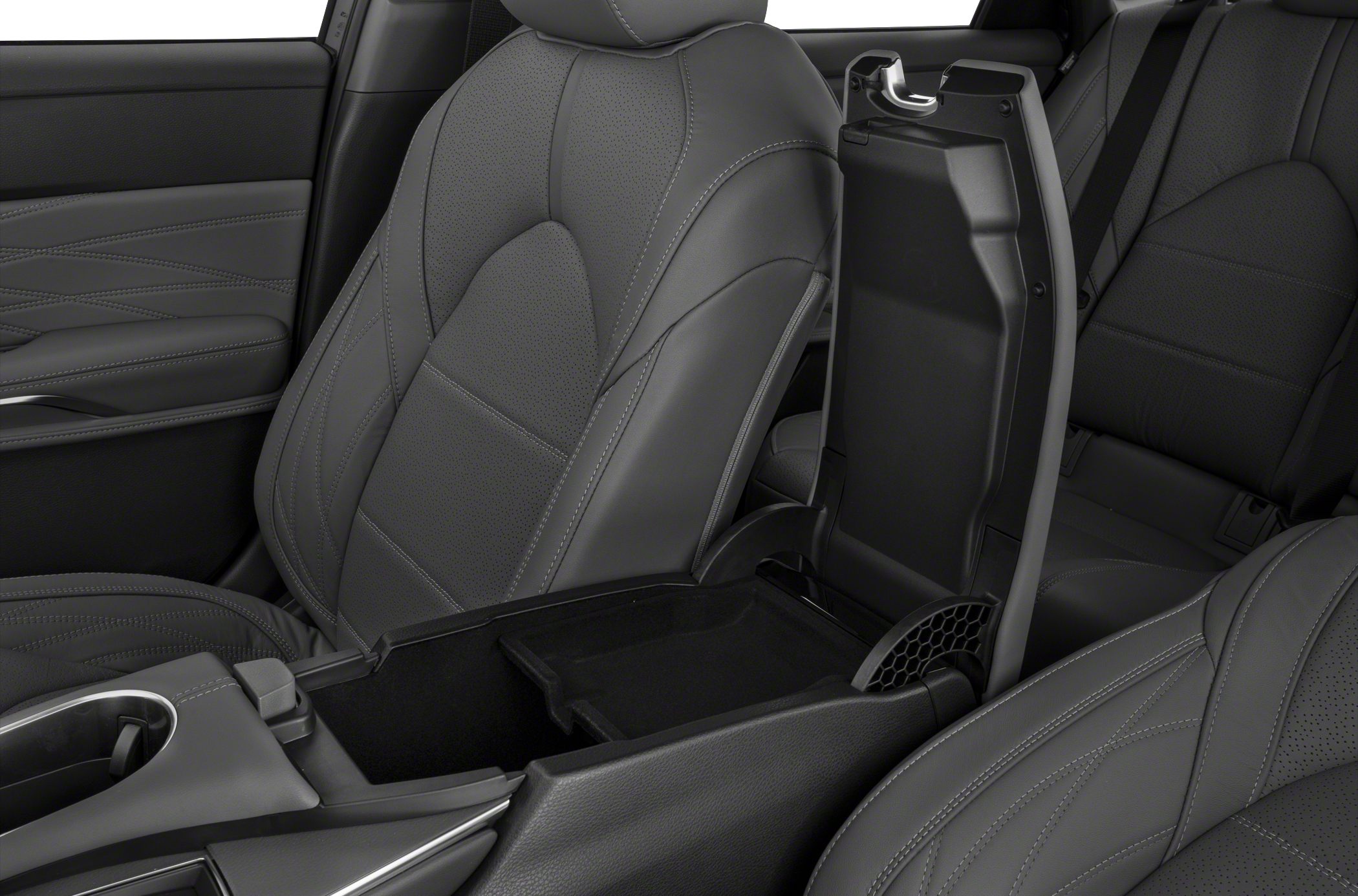 Leather seats and open center console storage with detailed stitching