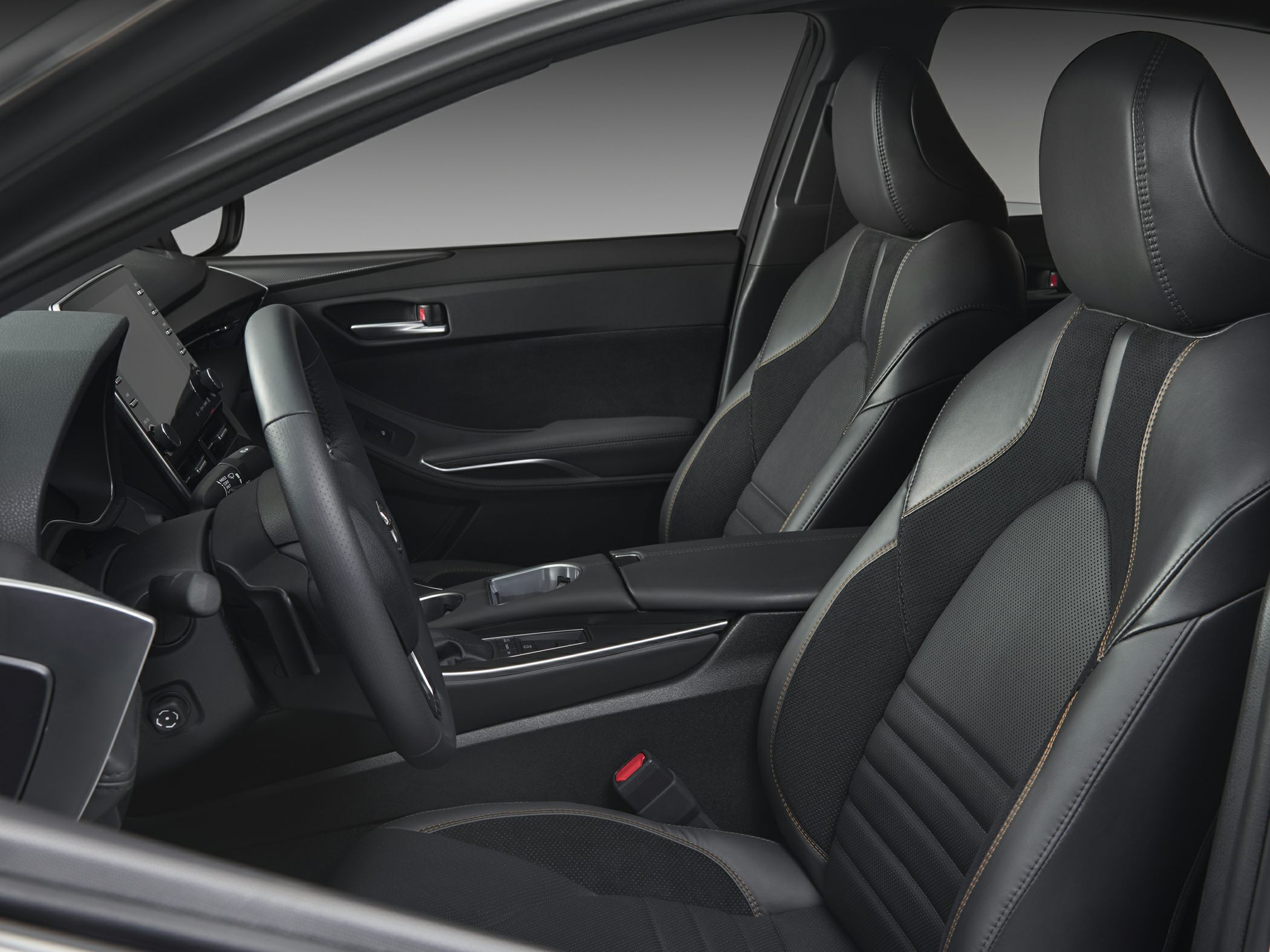 Black leather front seats with stitching and modern center console