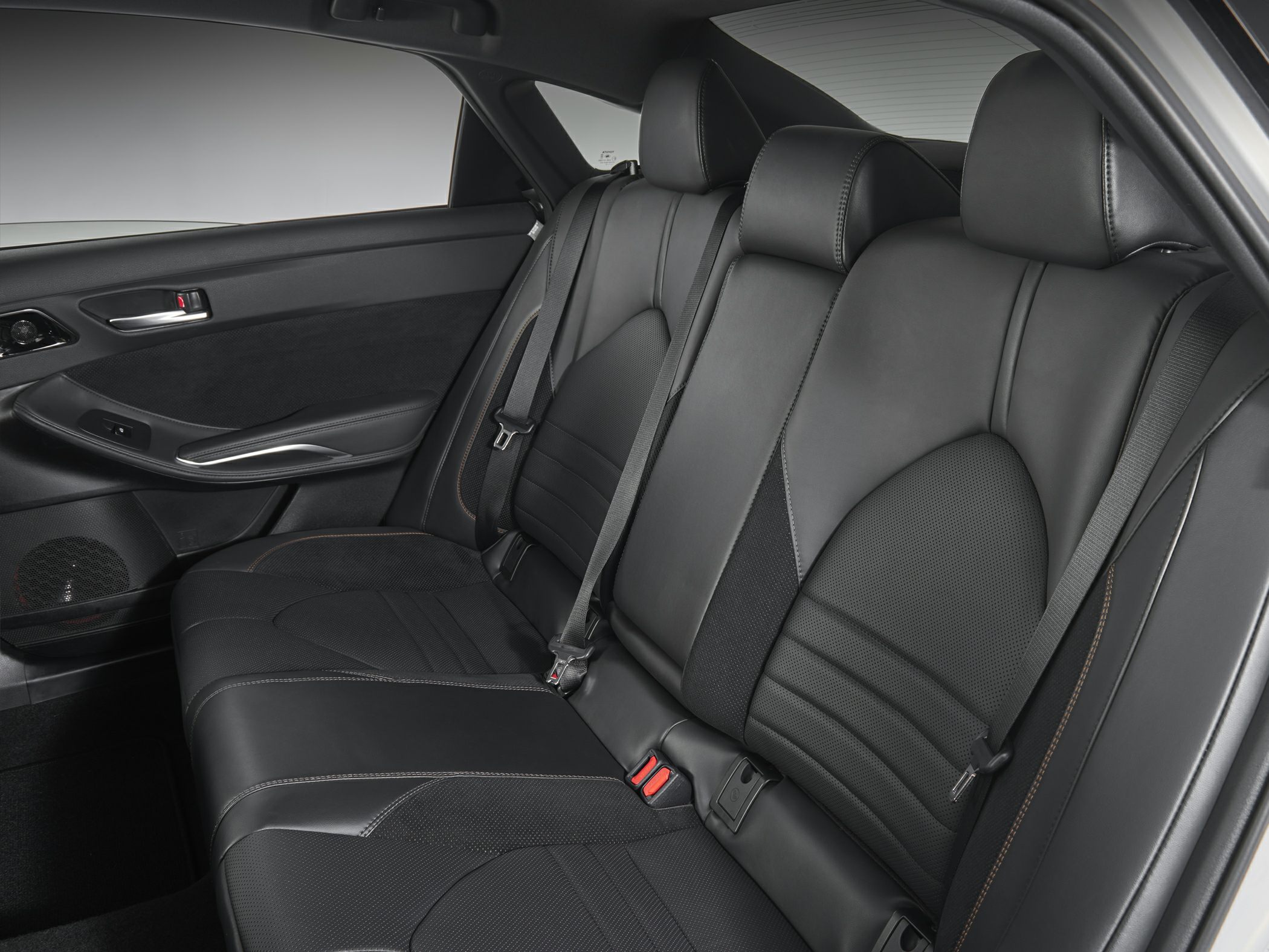 Premium black leather rear seats with stitching and integrated headrests