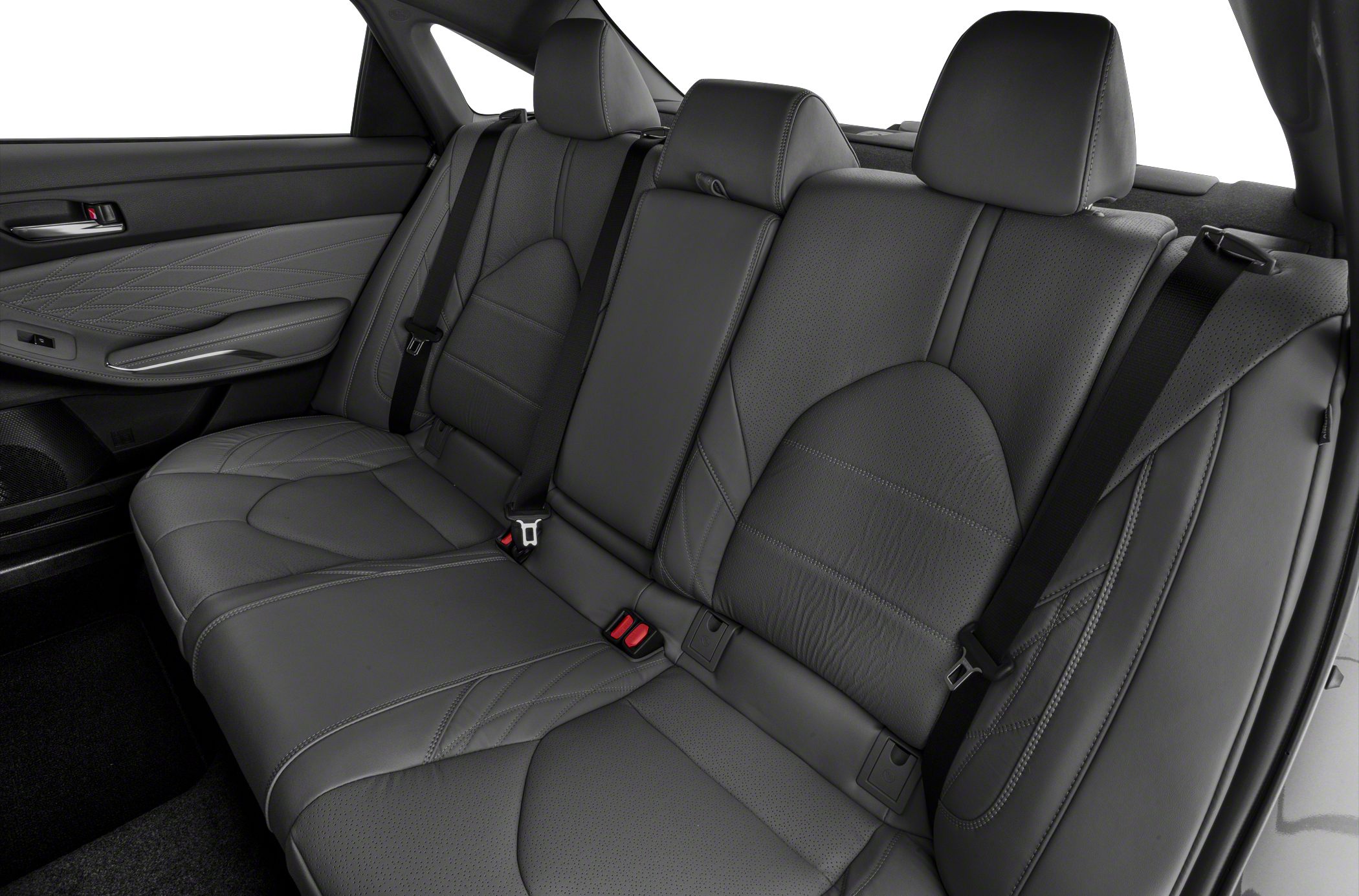 Rear leather seats with detailed stitching and seat belts