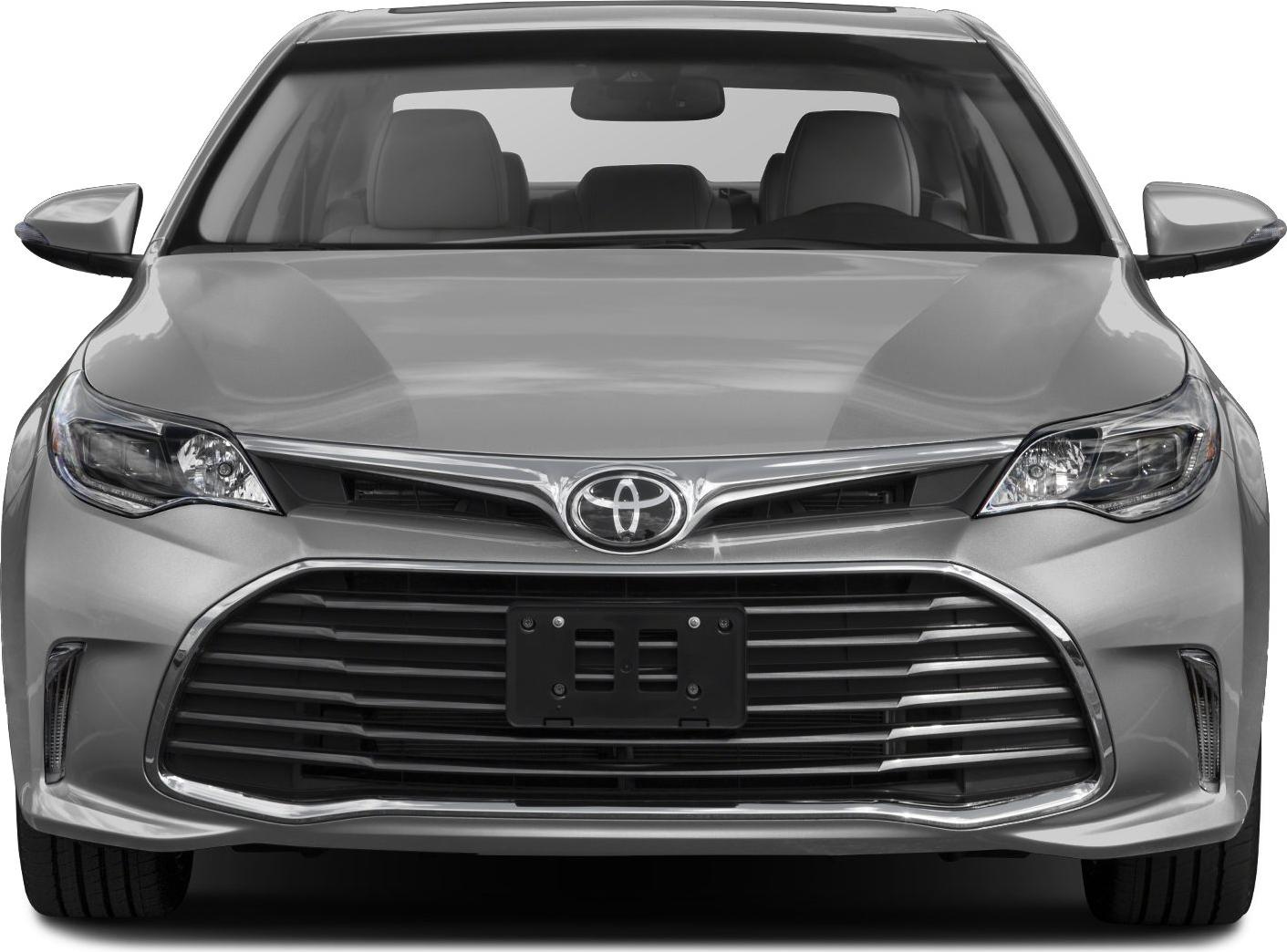 Wide chrome-accented grille and sleek headlights front view.