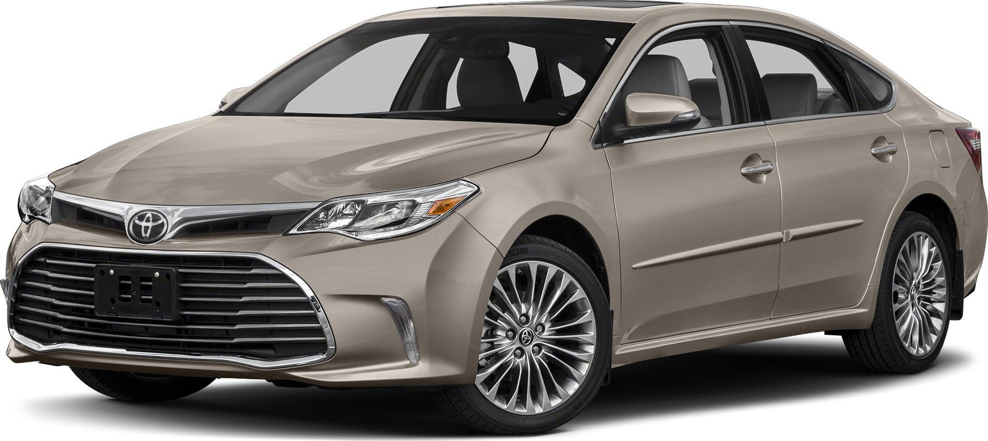 Front grille and side profile of a beige luxury sedan