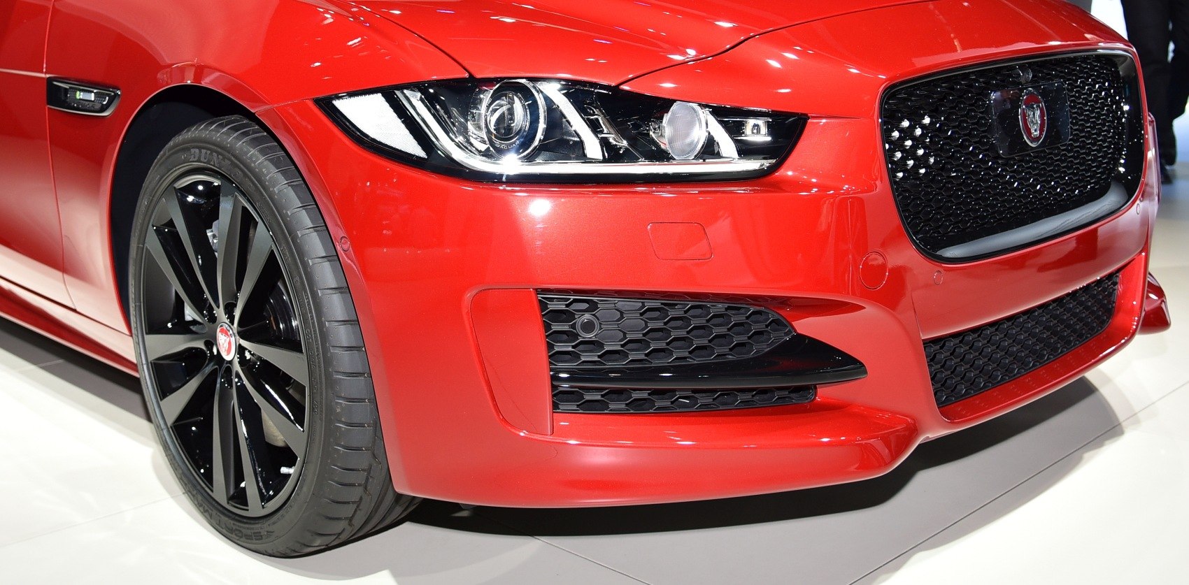 Front grille, LED headlight, and black alloy wheel close-up