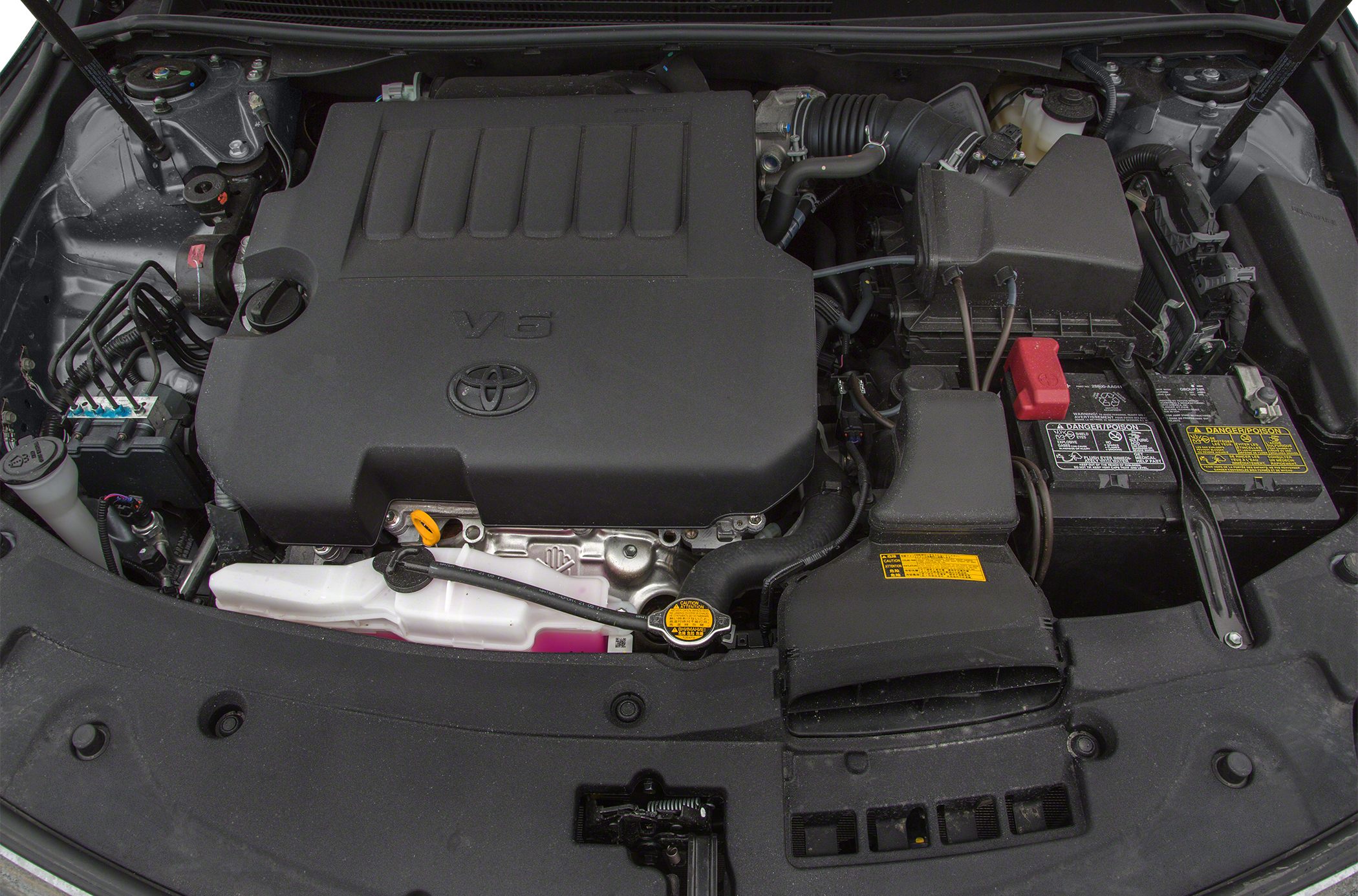 Close-up of a V6 engine bay with Toyota emblem