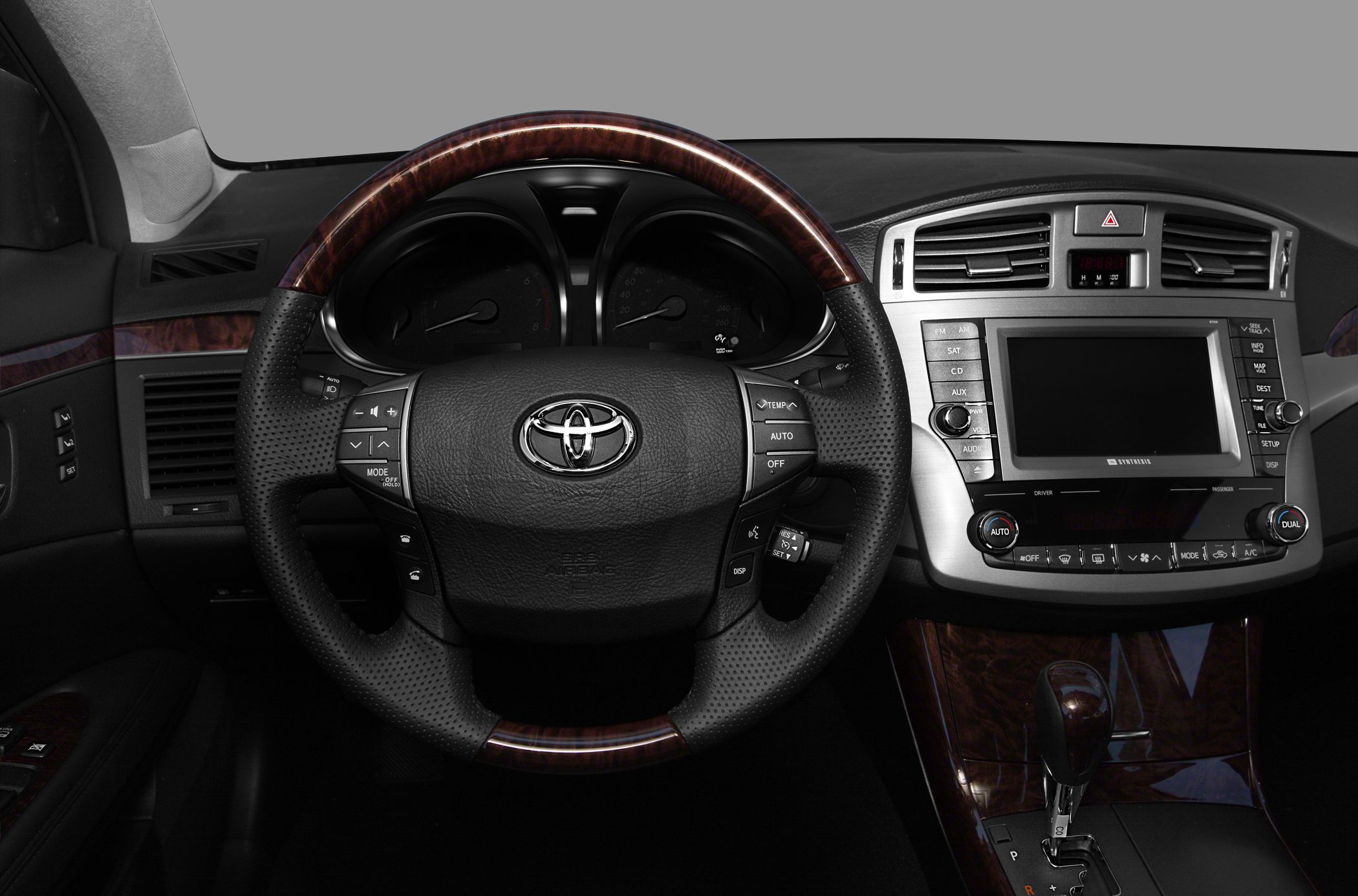 Steering wheel and dashboard with infotainment and control buttons