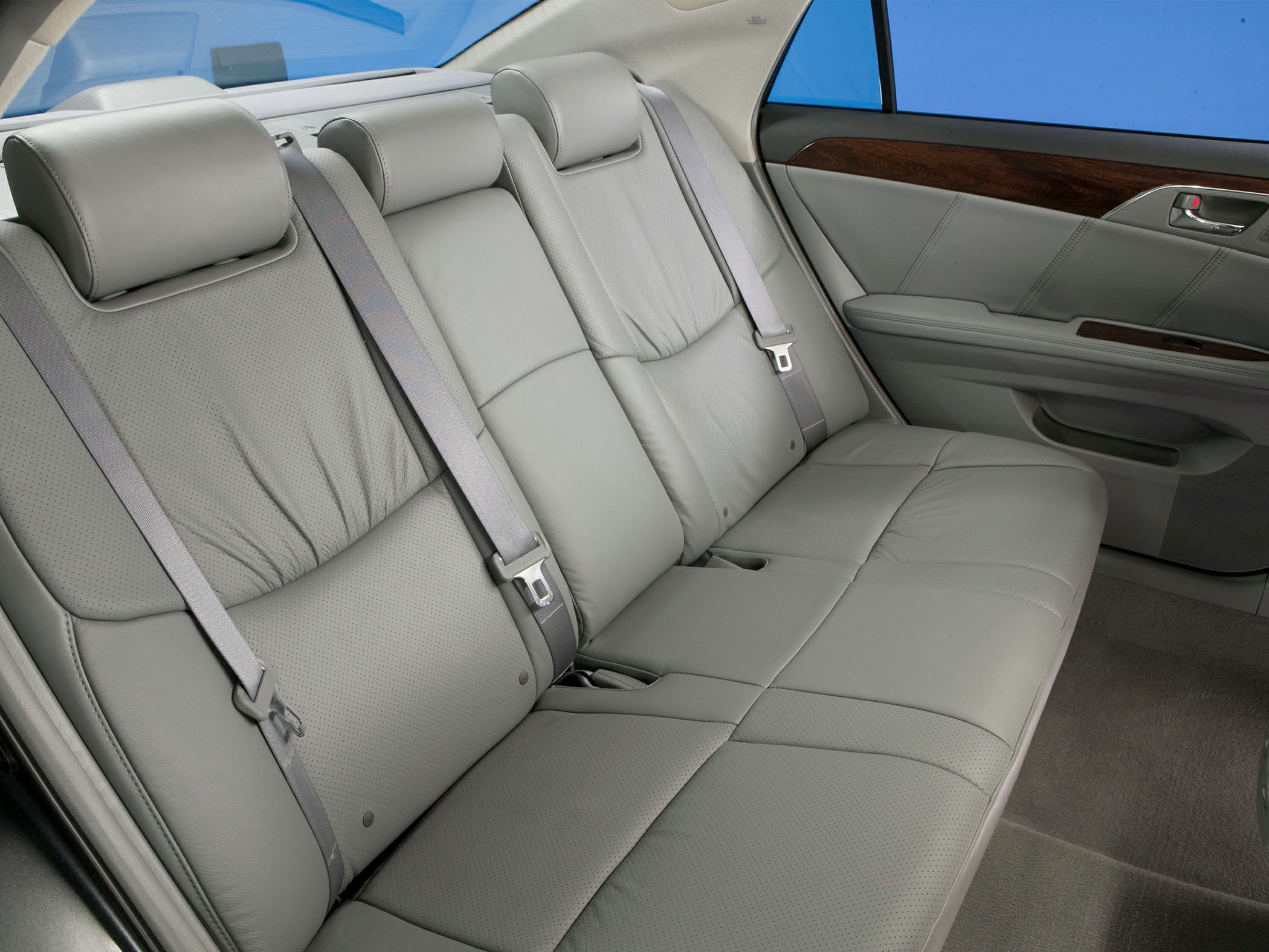 Gray leather rear seats with seat belts and wood trim door panel