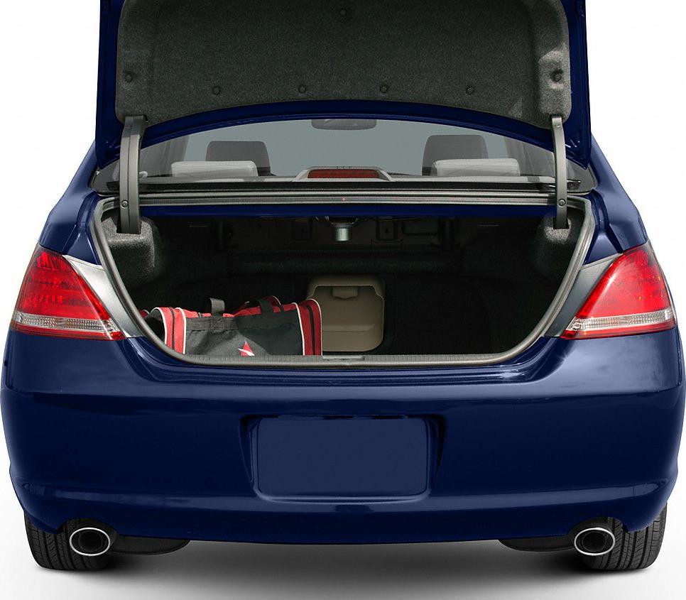 Open trunk with spacious cargo area and dual exhausts