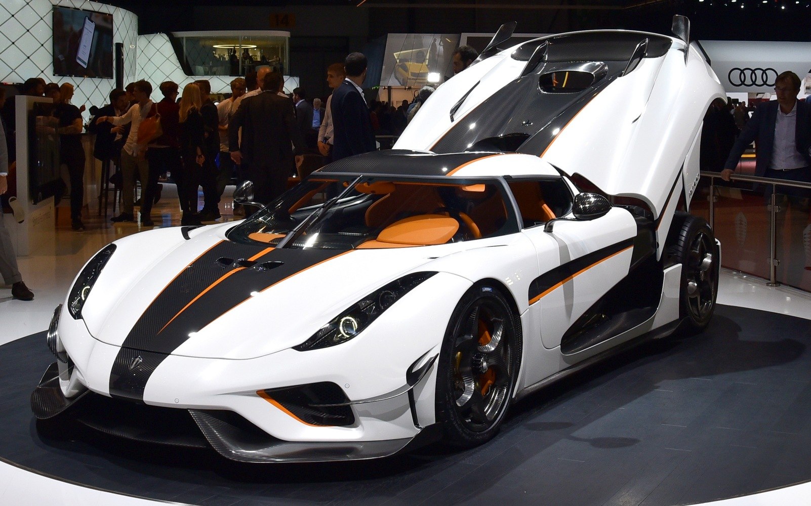 Sports car with dihedral doors and carbon fiber accents