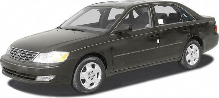 Front-side view of dark-colored mid-size sedan with detailed headlights and wheels