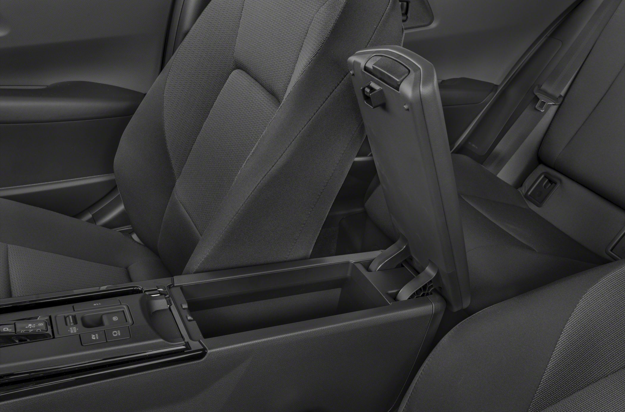 Spacious center console storage with ergonomic armrest and front seats.