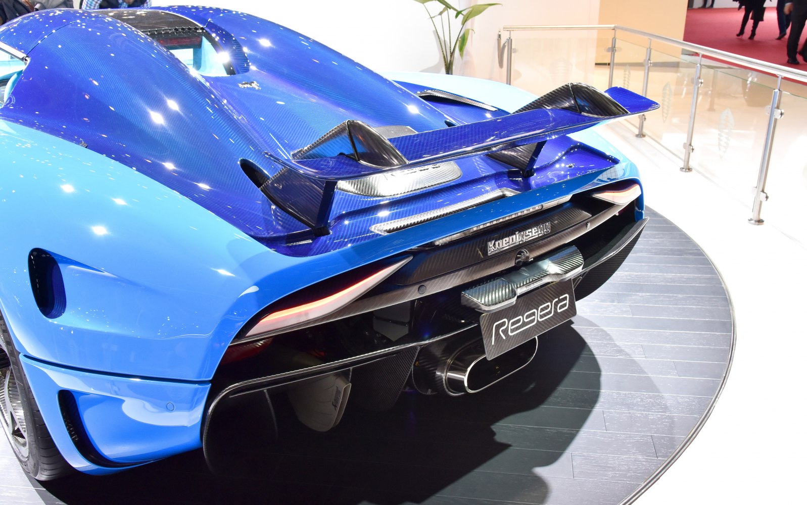 Rear view with carbon fiber wing, exhaust, and aerodynamic design