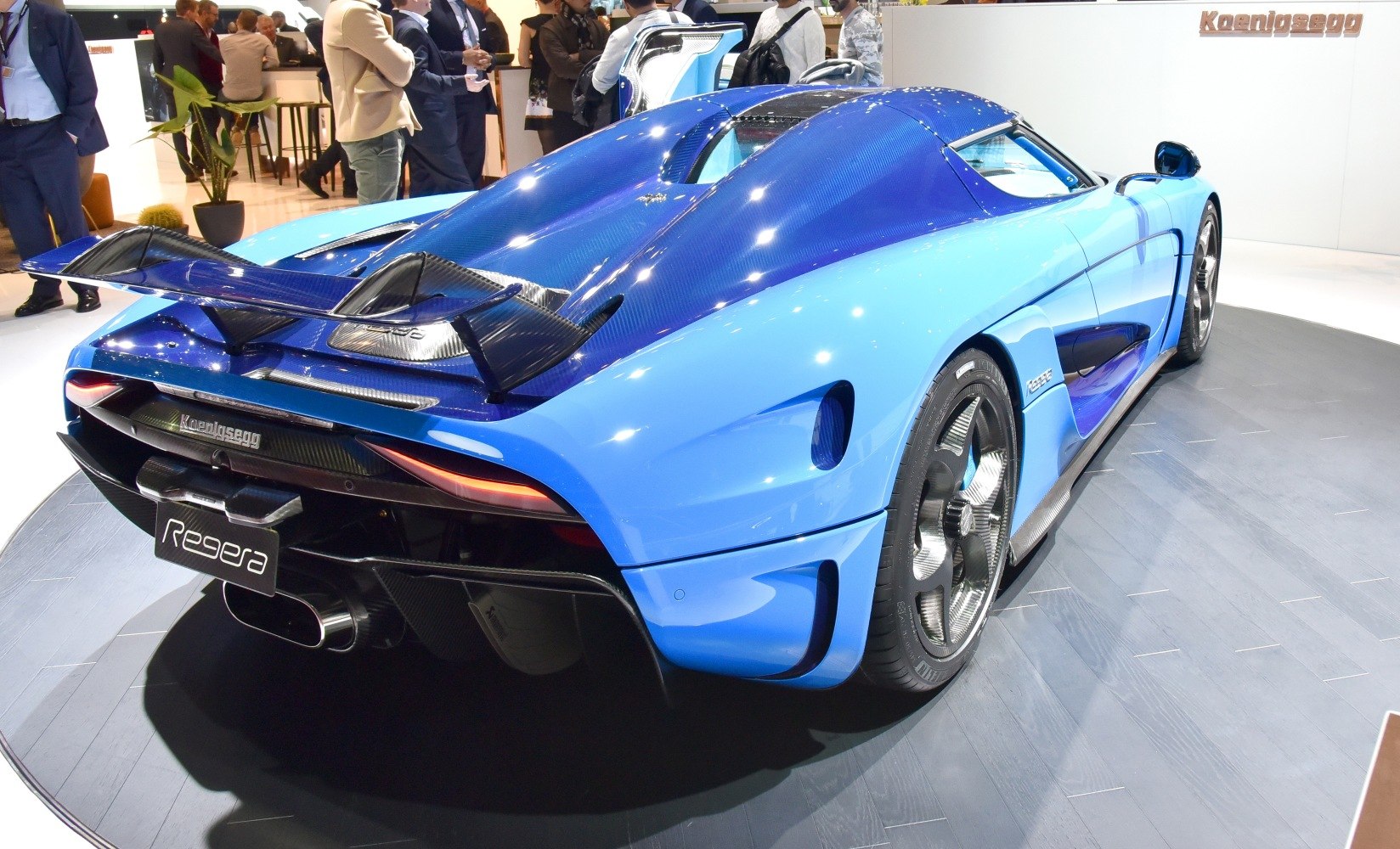 Rear view with large carbon fiber wing and aerodynamic features