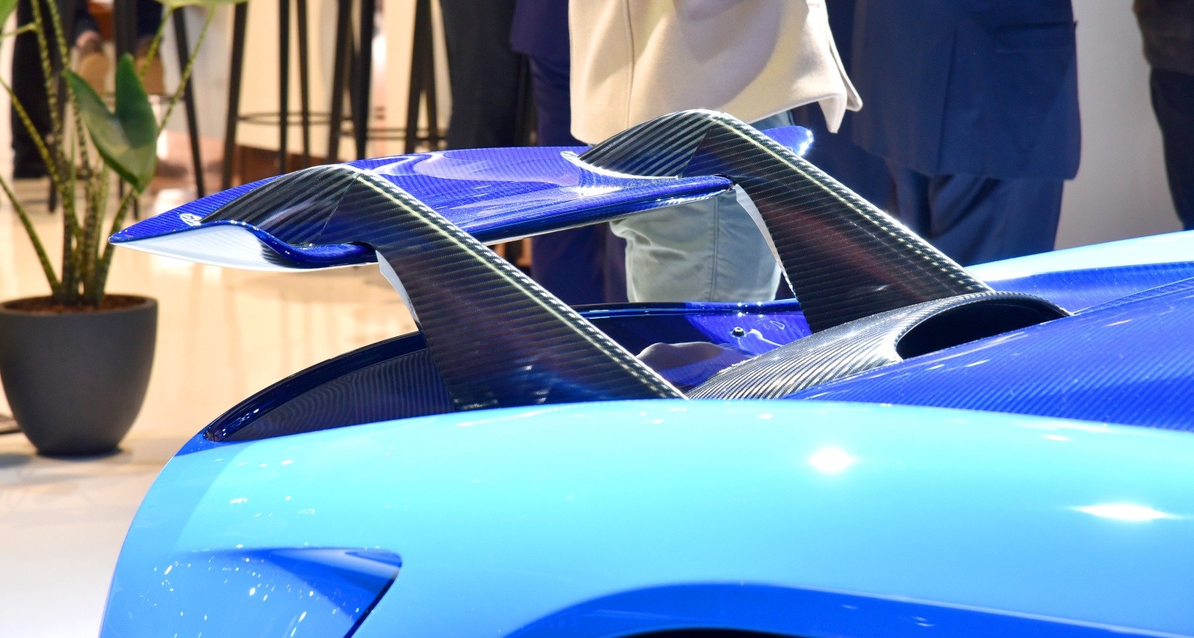 Rear carbon fiber aerodynamic spoiler on high-performance sports car